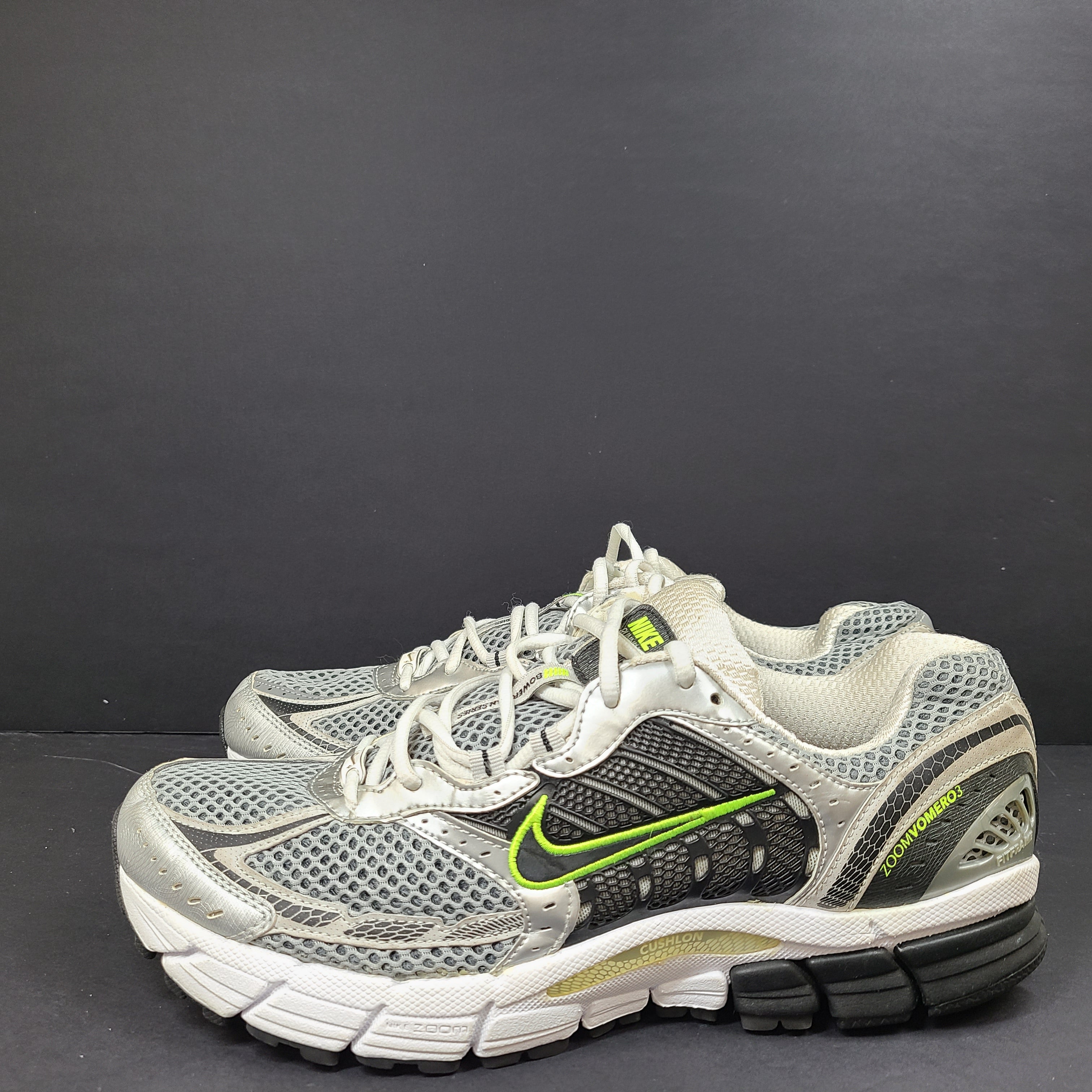 Gray and green Nike Zoom Vomero 3 running shoes in US size 11 designed for responsive comfort and stability.