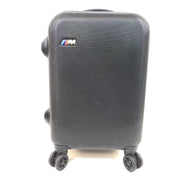 Black and red BMW suitcase featuring a TSA lock and four spinner wheels for easy maneuvering.
