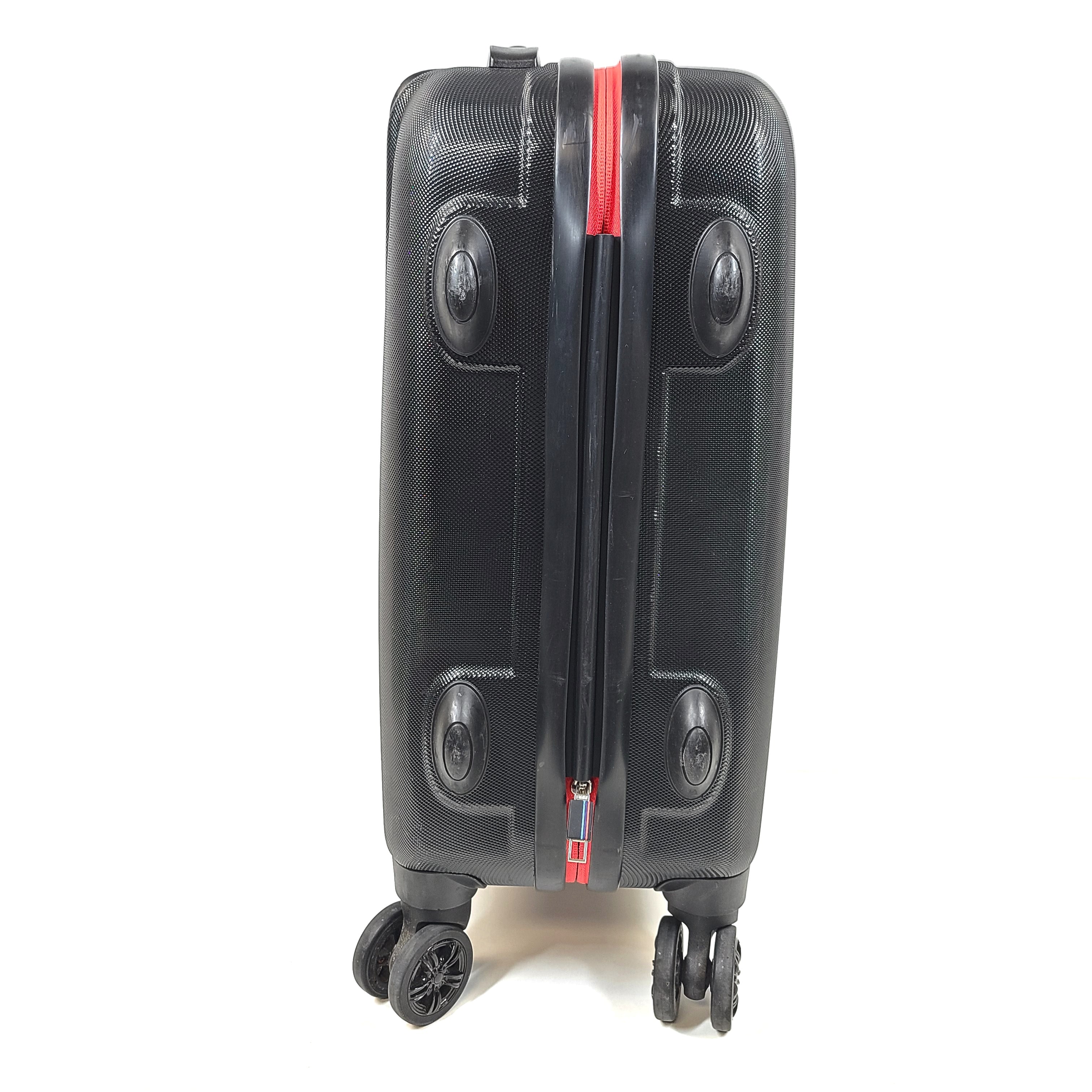 Black and red BMW suitcase featuring a TSA lock and four spinner wheels for easy maneuvering.