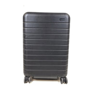Black Away suitcase with built-in combination lock and organized interior compartments for efficient packing.