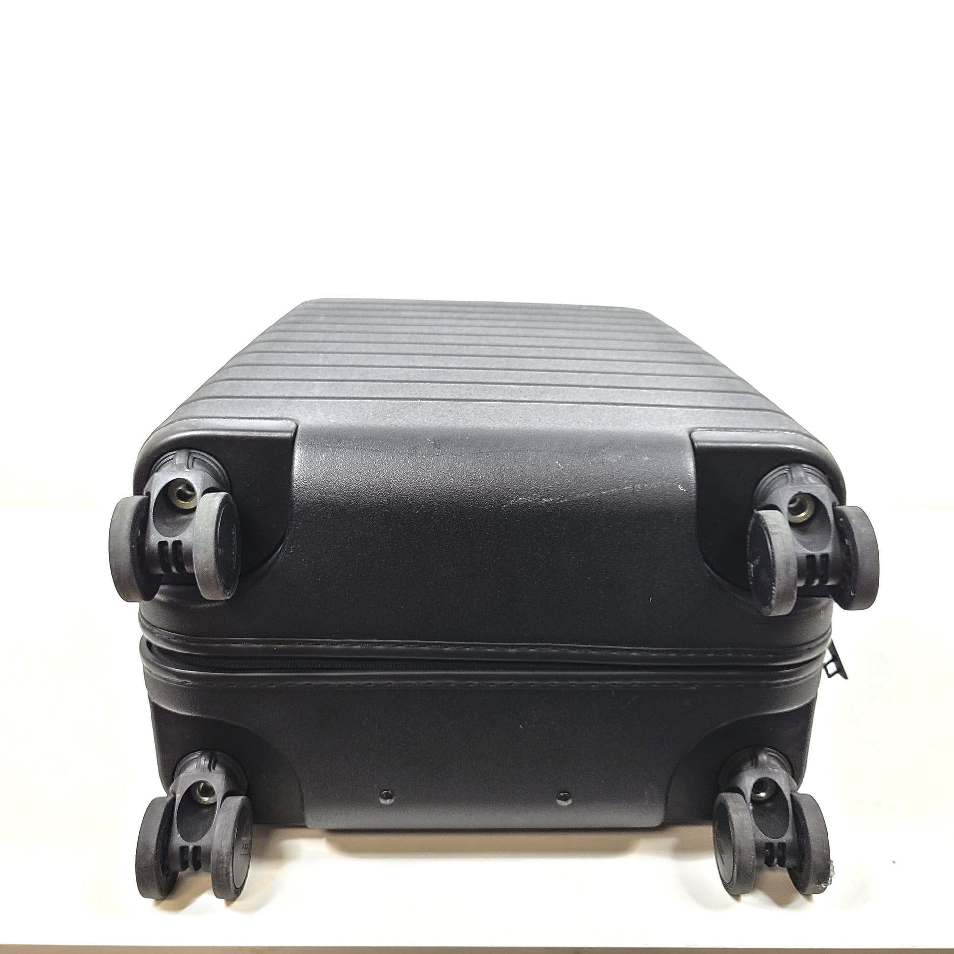 Black Away suitcase with built-in combination lock and organized interior compartments for efficient packing.