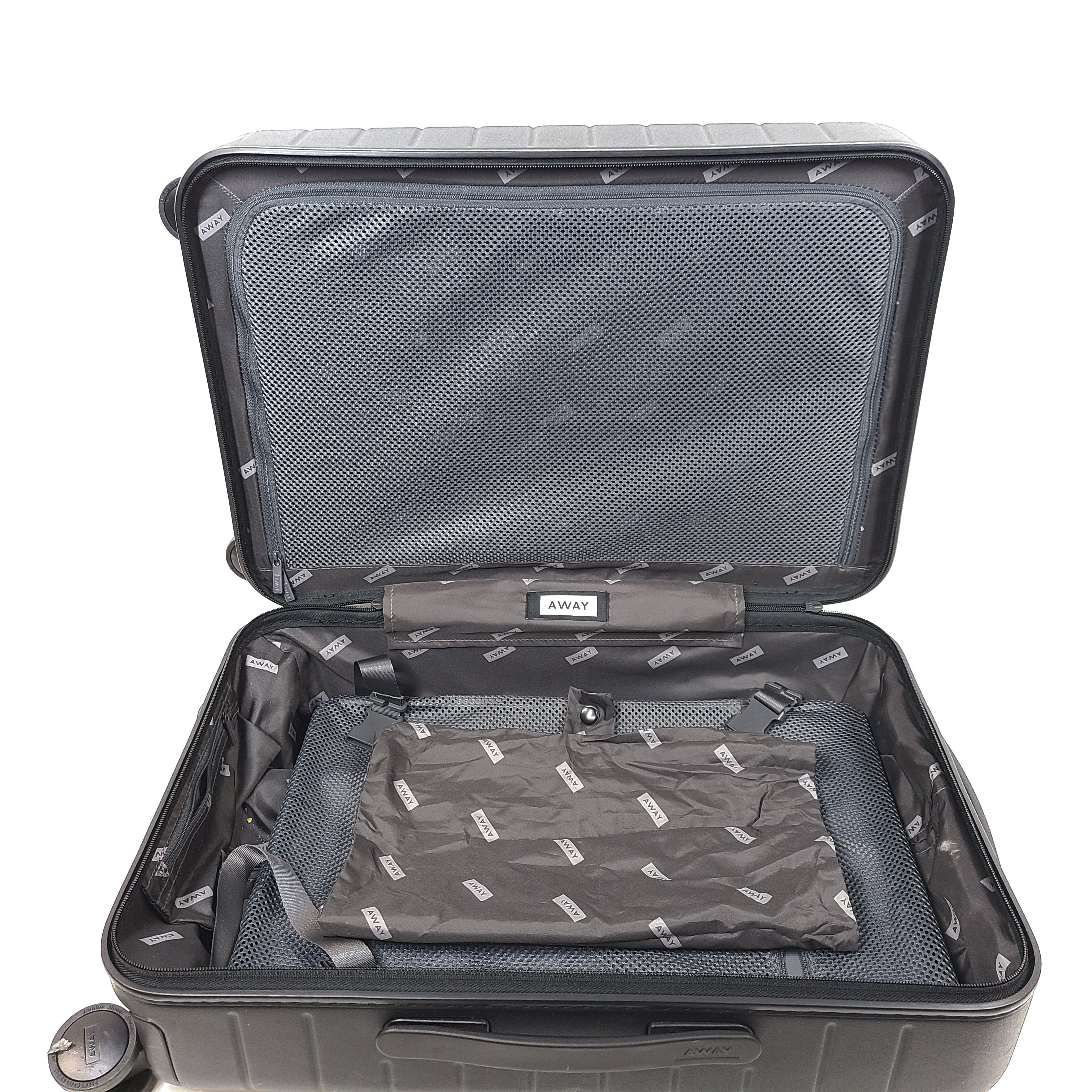 Black Away suitcase with built-in combination lock and organized interior compartments for efficient packing.