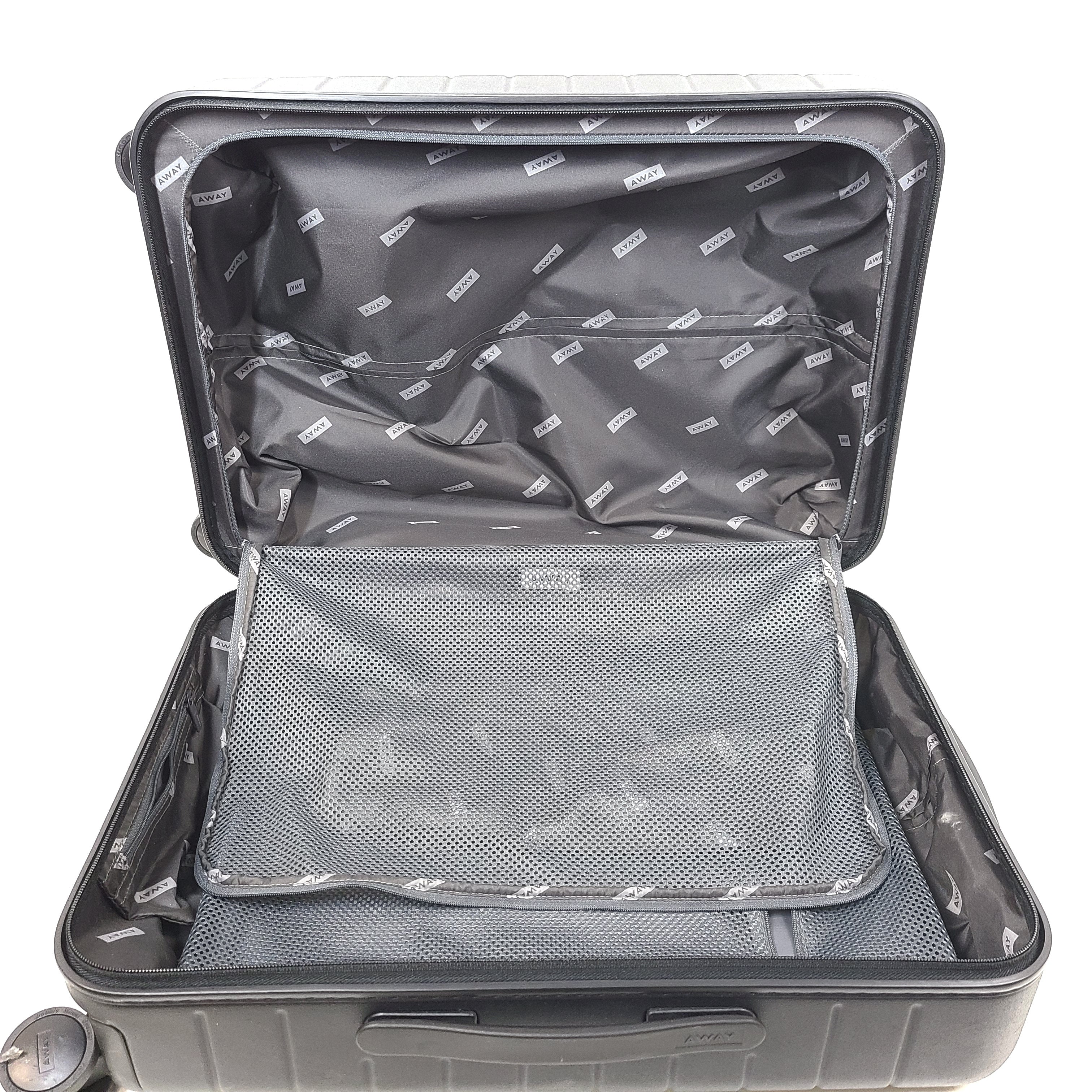 Black Away suitcase with built-in combination lock and organized interior compartments for efficient packing.