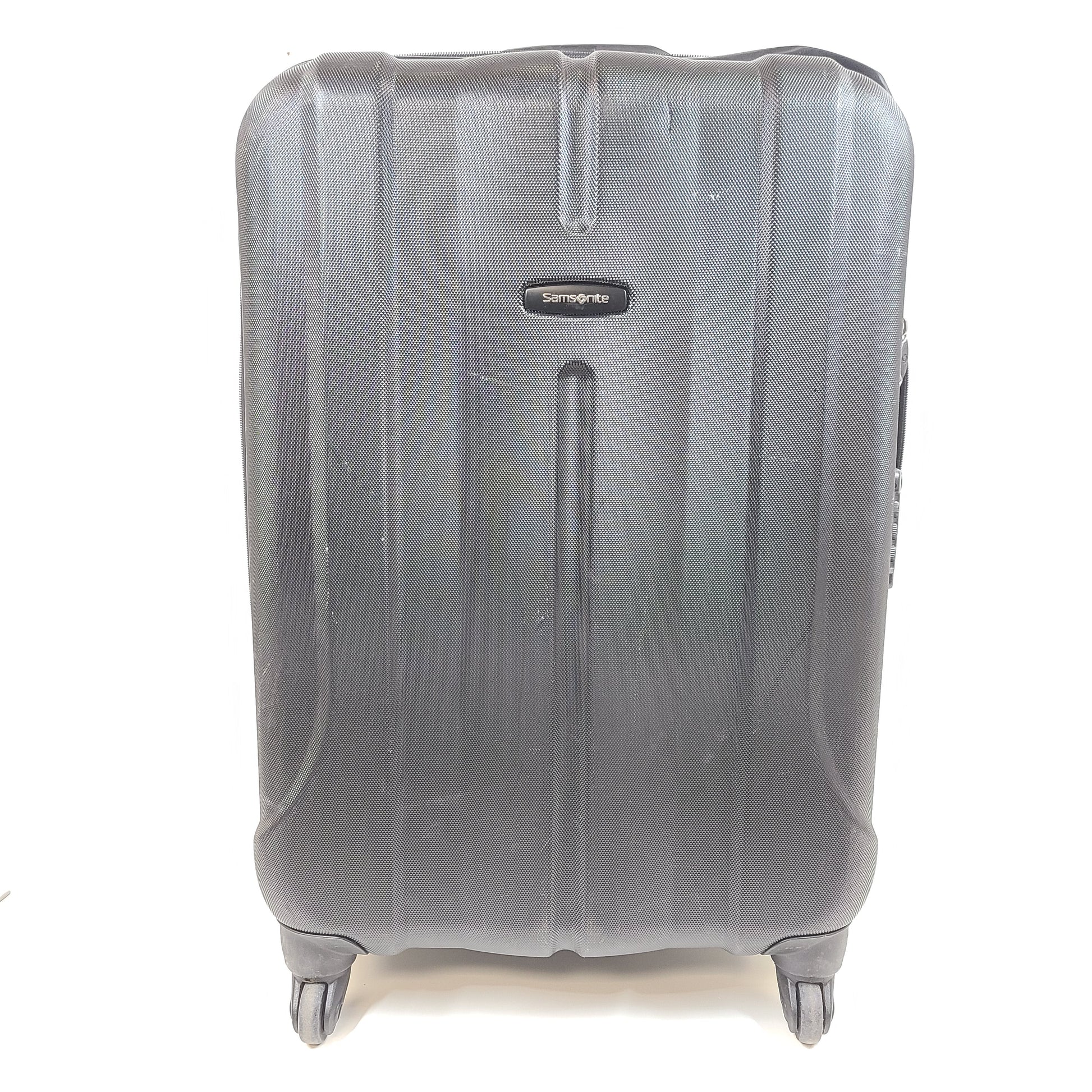 Black Samsonite 4-wheel spinner hardside suitcase with front Samsonite logo and organized interior.