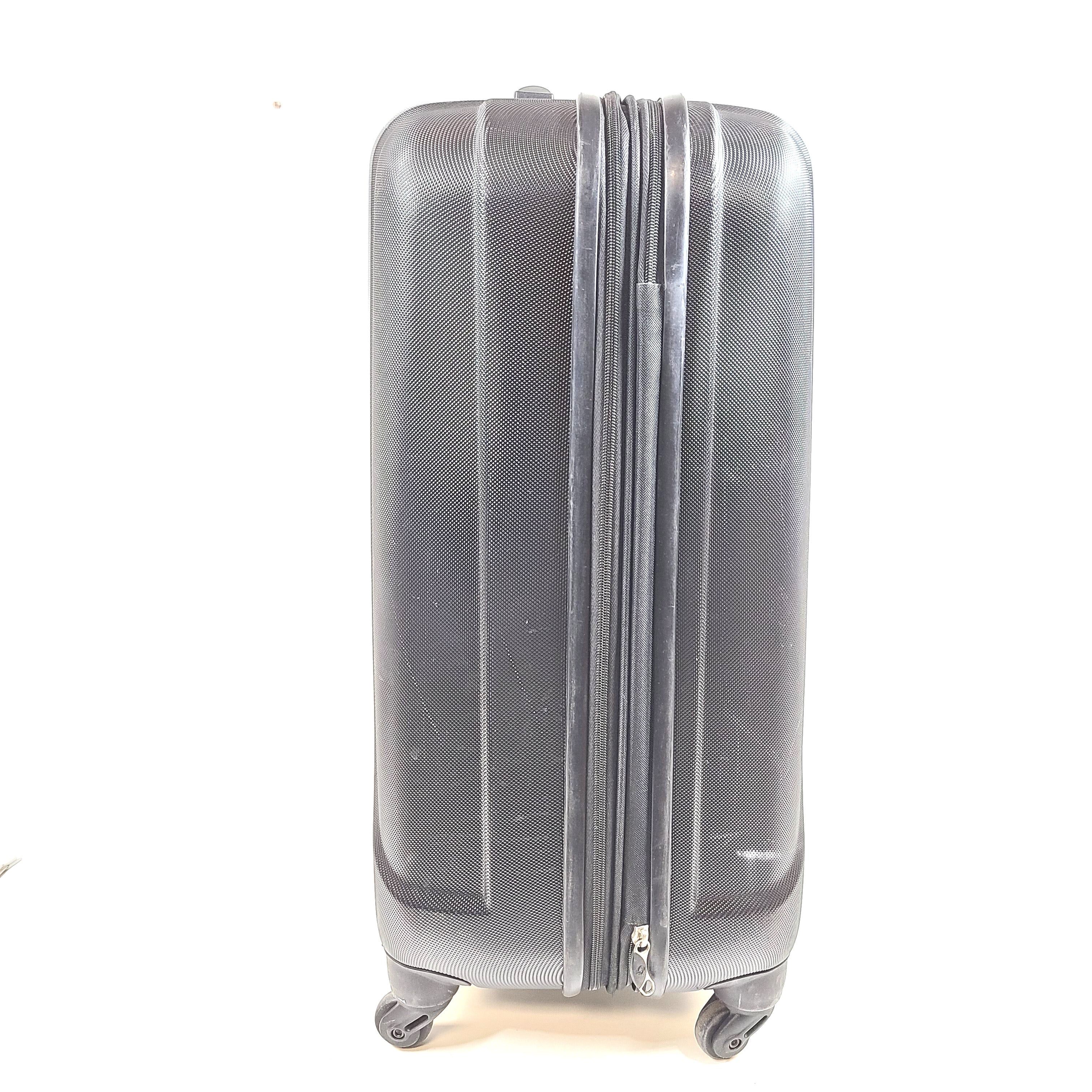 Black Samsonite 4-wheel spinner hardside suitcase with front Samsonite logo and organized interior.