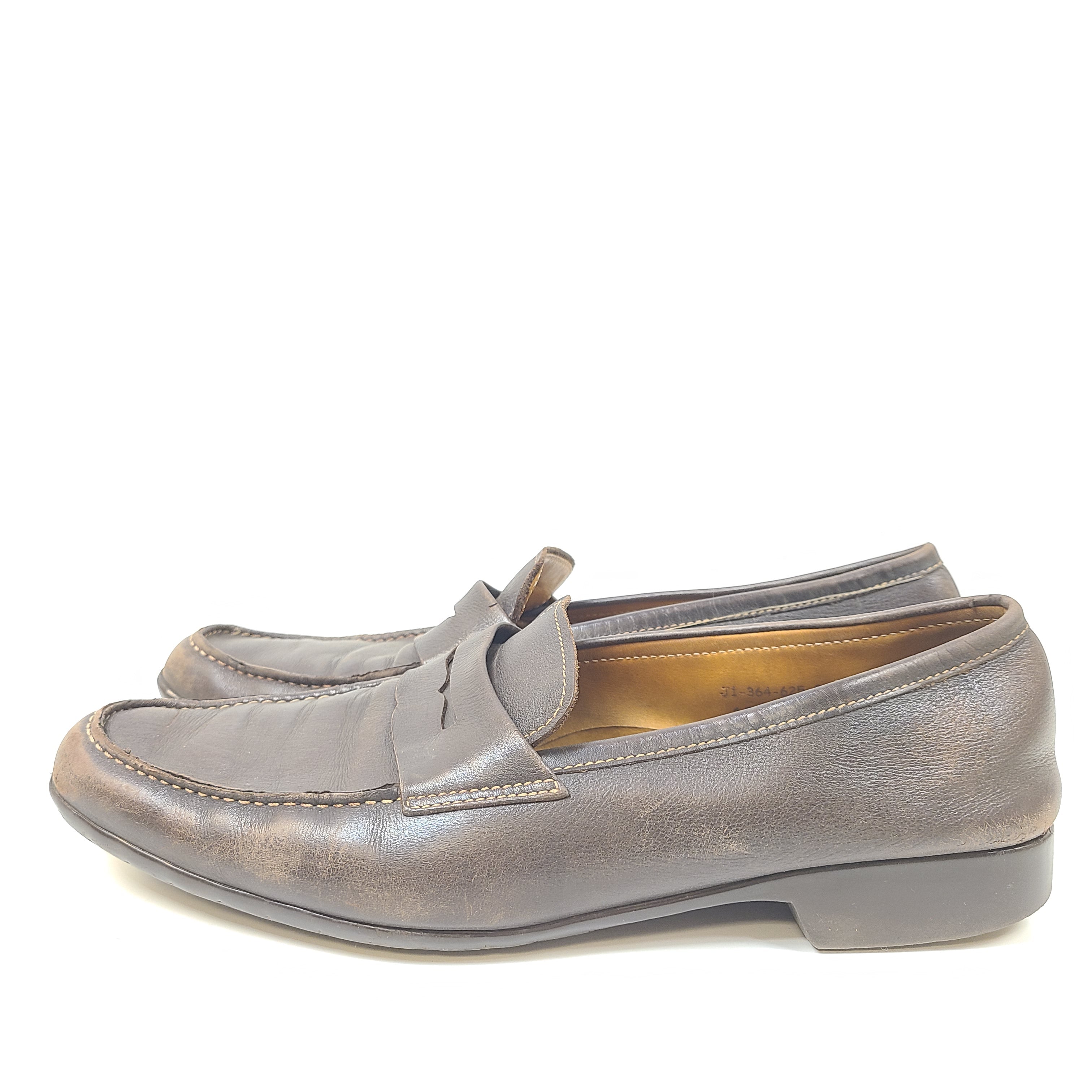 Brown leather Johnston & Murphy loafers in men's size 10.5 D with classic slip-on styling.