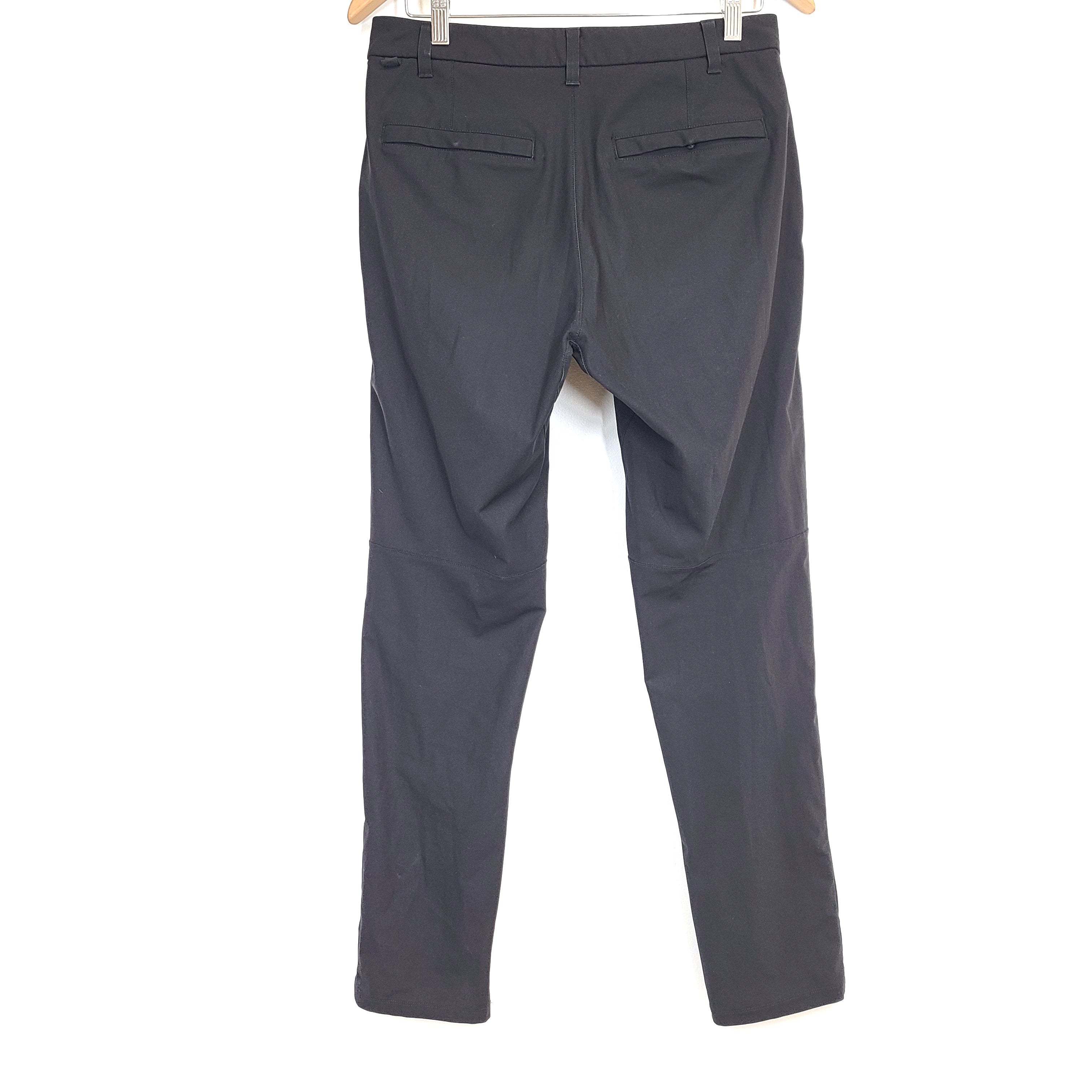 Black Lululemon men's pants in size 30 with polyester fabric and branded logo.