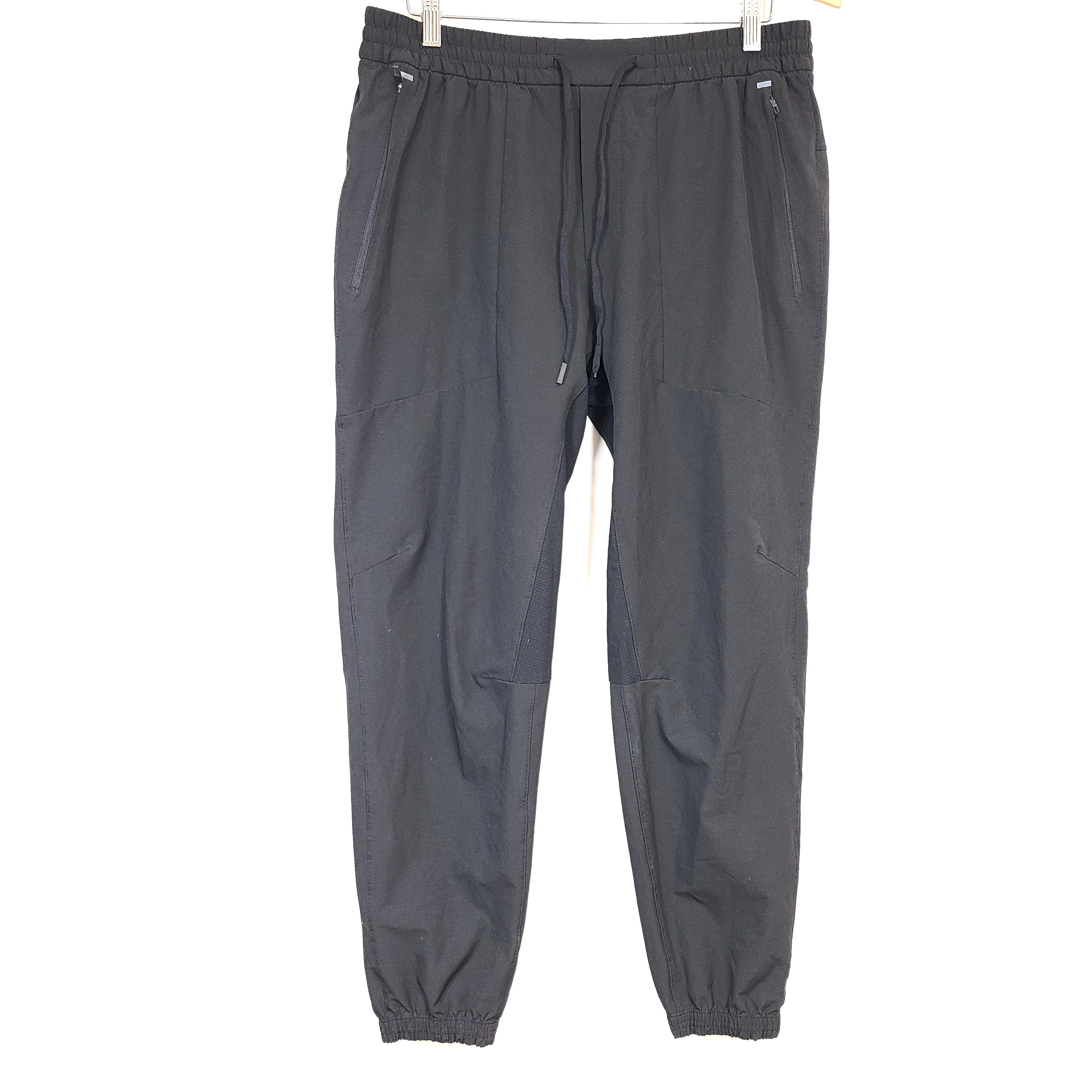 Black Lululemon joggers size XL with elastic waistband and tapered leg for comfortable everyday wear.