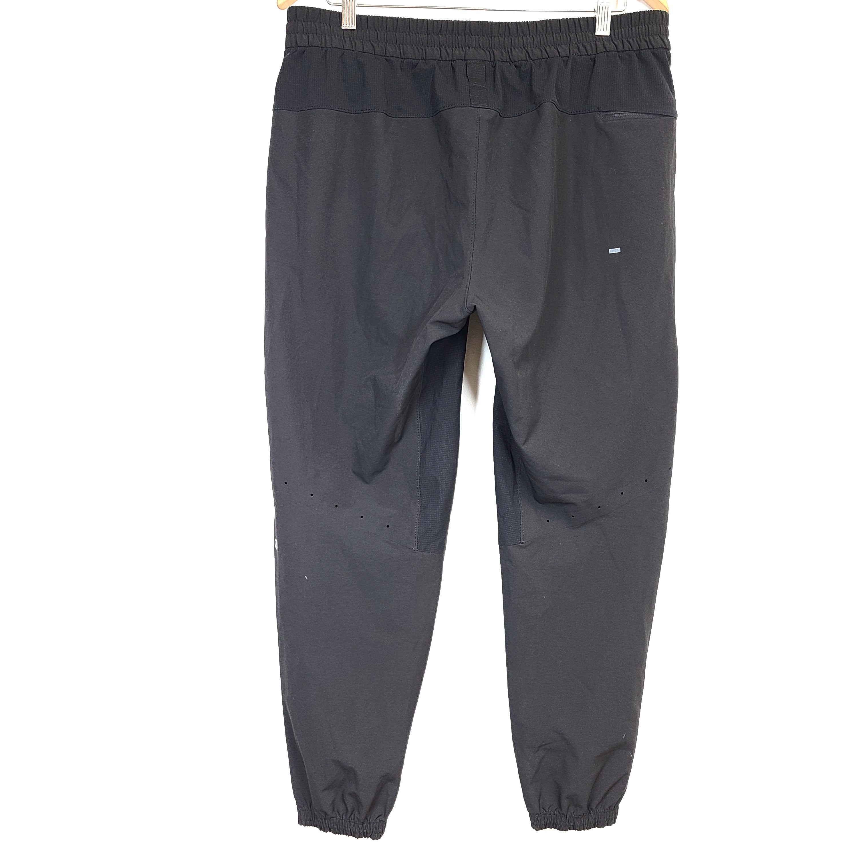 Black Lululemon joggers size XL with elastic waistband and tapered leg for comfortable everyday wear.