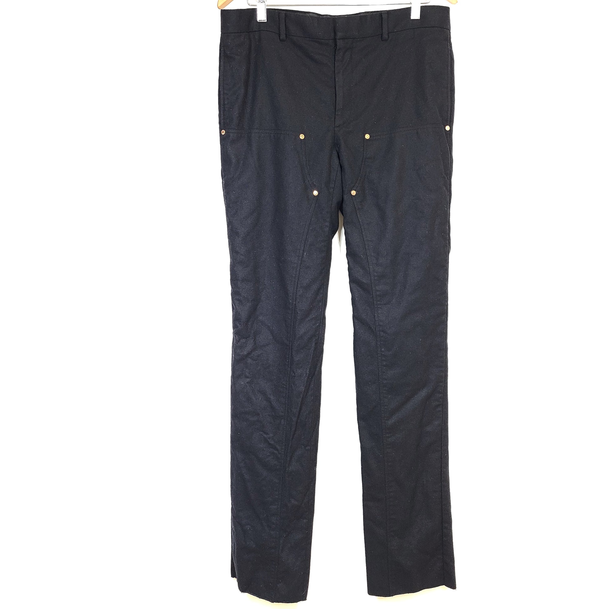 Black Givenchy wool trousers, size 52, with tailored straight-leg styling.