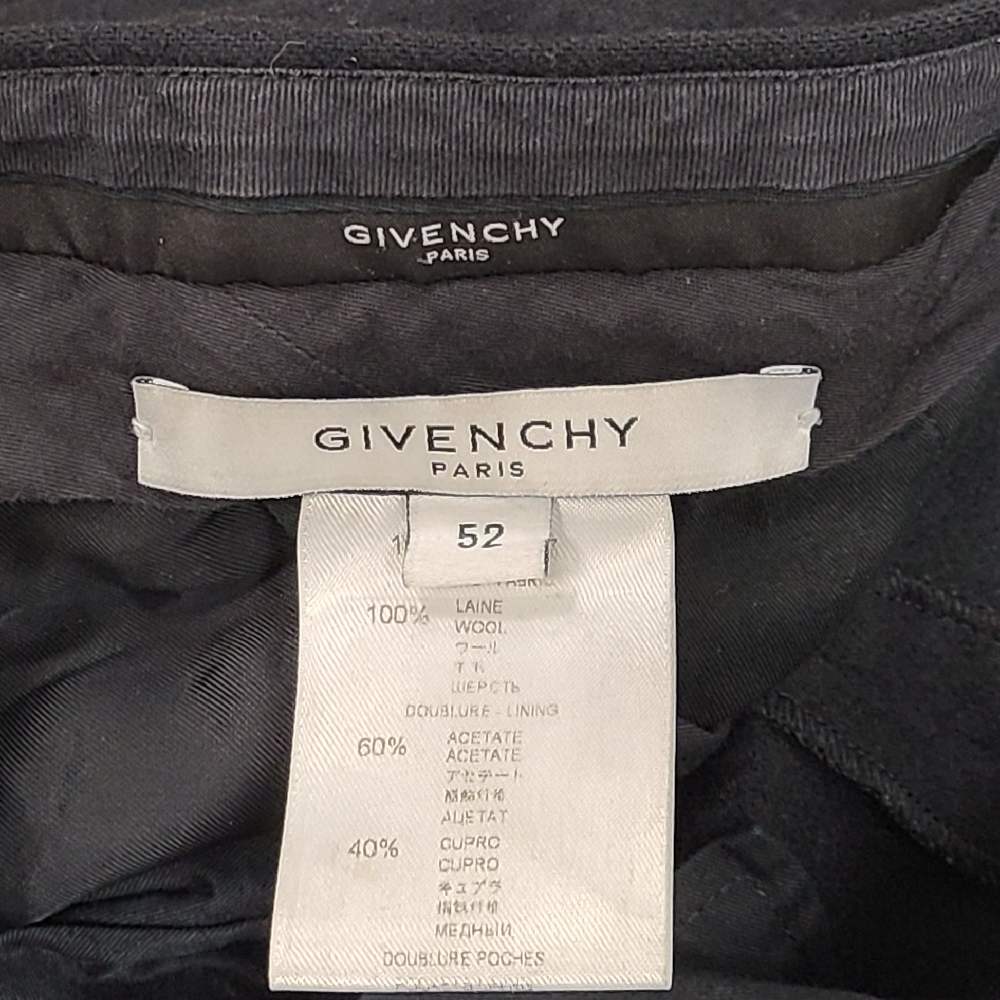 Black Givenchy wool trousers, size 52, with tailored straight-leg styling.