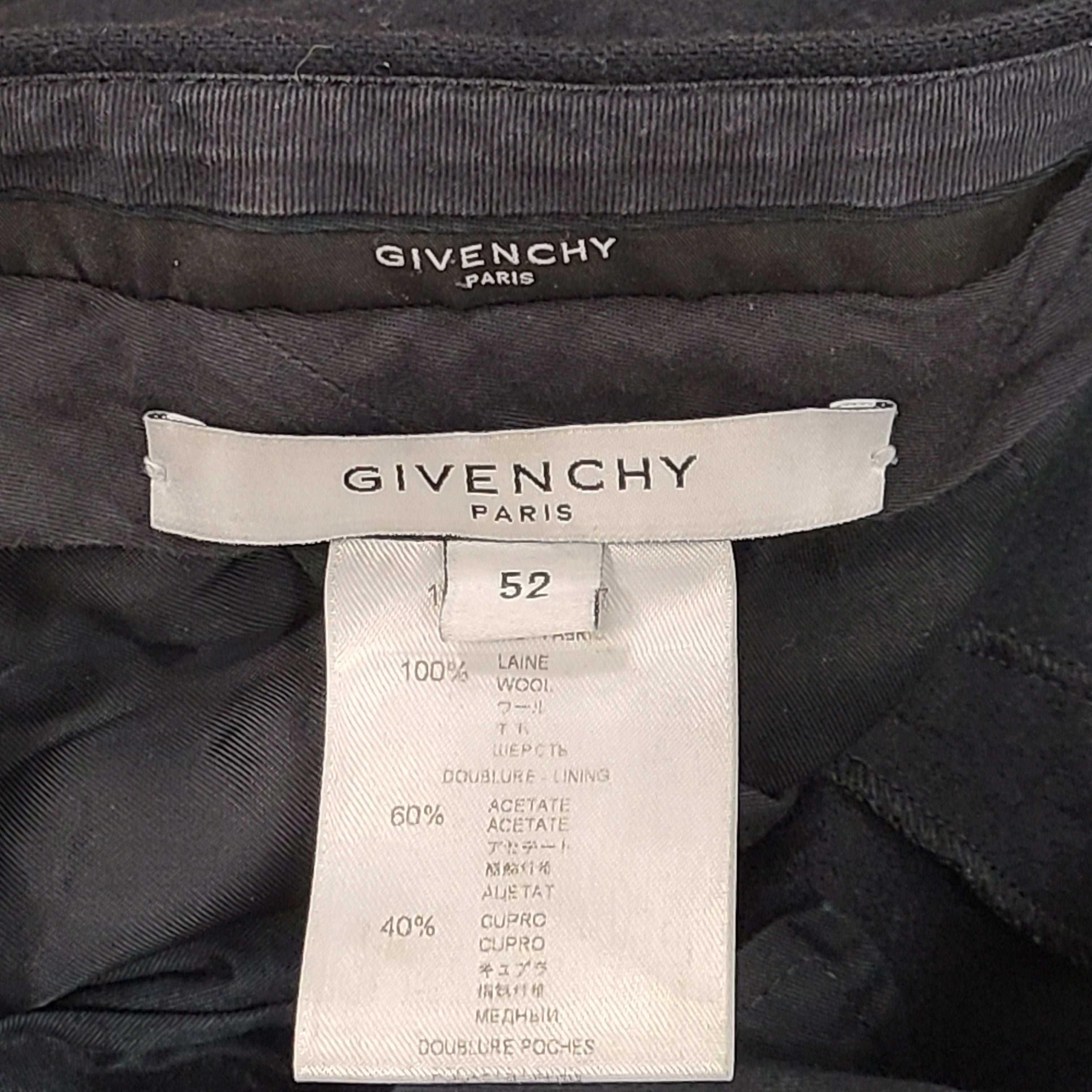 Black Givenchy wool trousers, size 52, with tailored straight-leg styling.