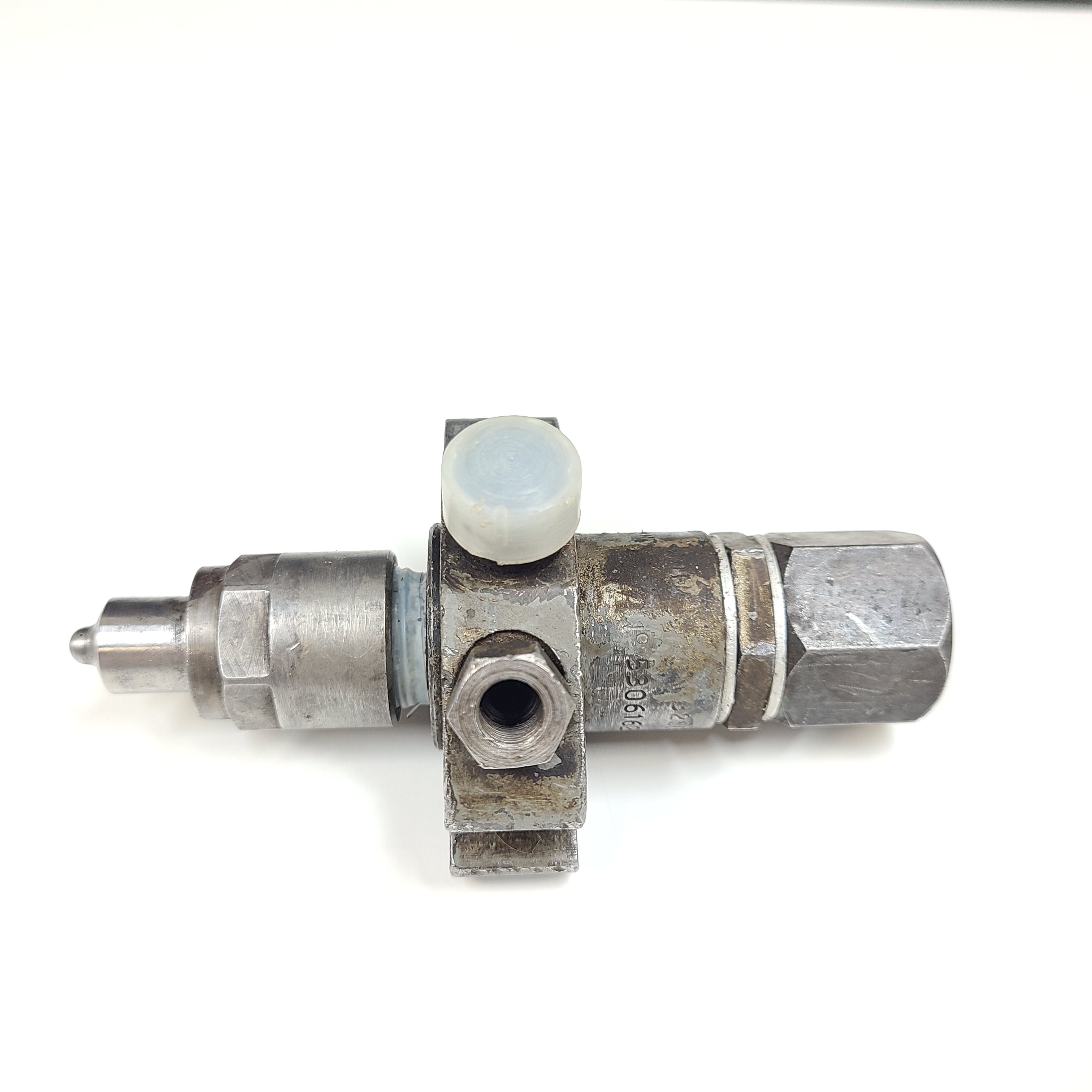Silver hydraulic valve A3205085 with part marking 5306162 XC and surface wear.