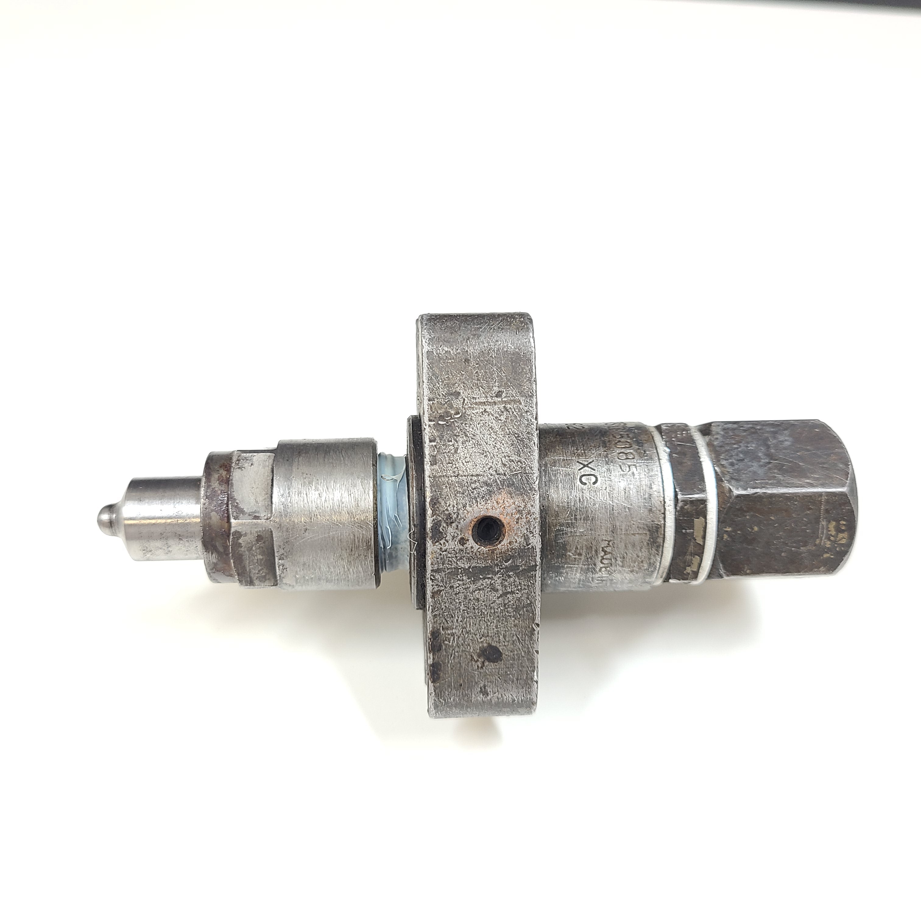 Silver hydraulic valve A3205085 with part marking 5306162 XC and surface wear.