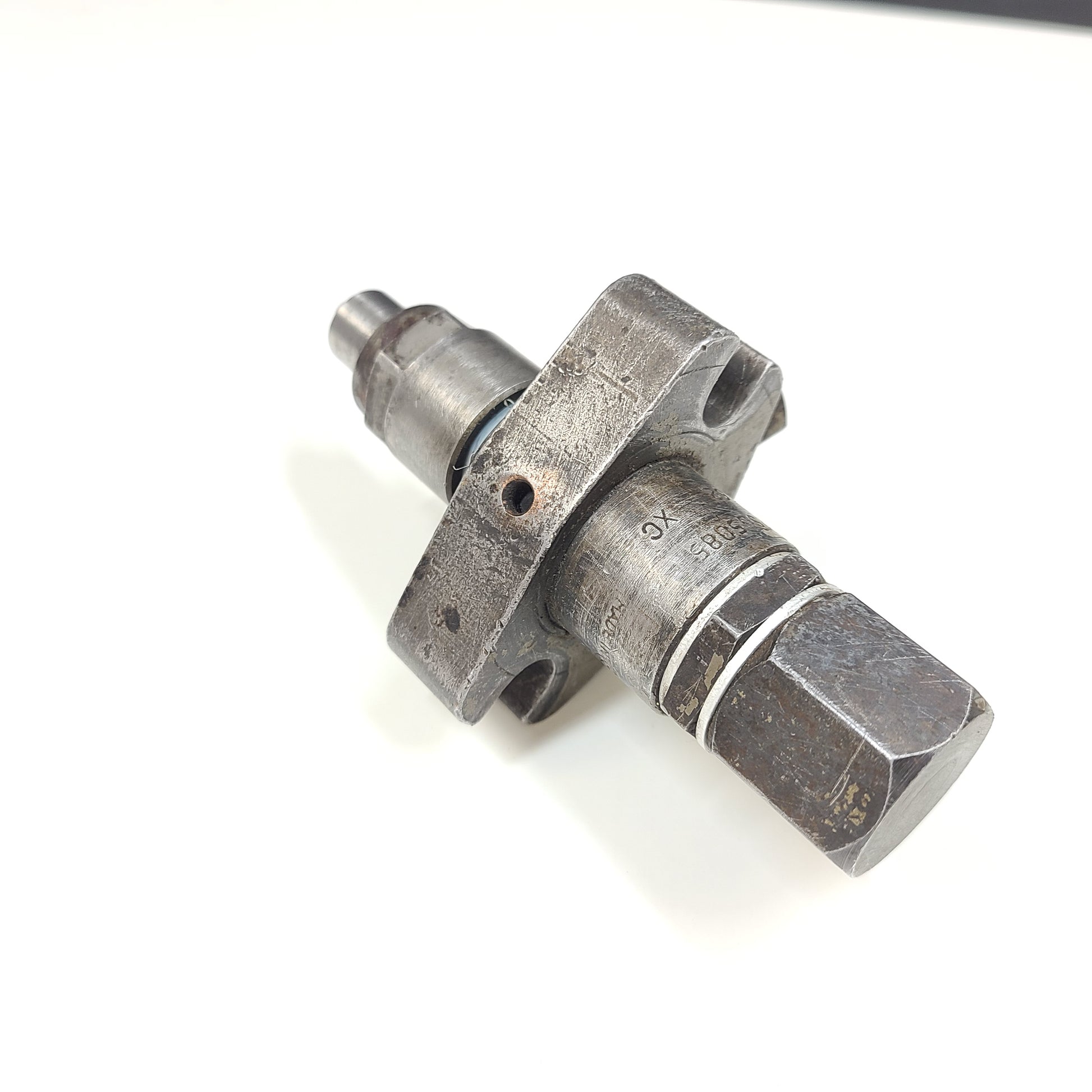Silver hydraulic valve A3205085 with part marking 5306162 XC and surface wear.