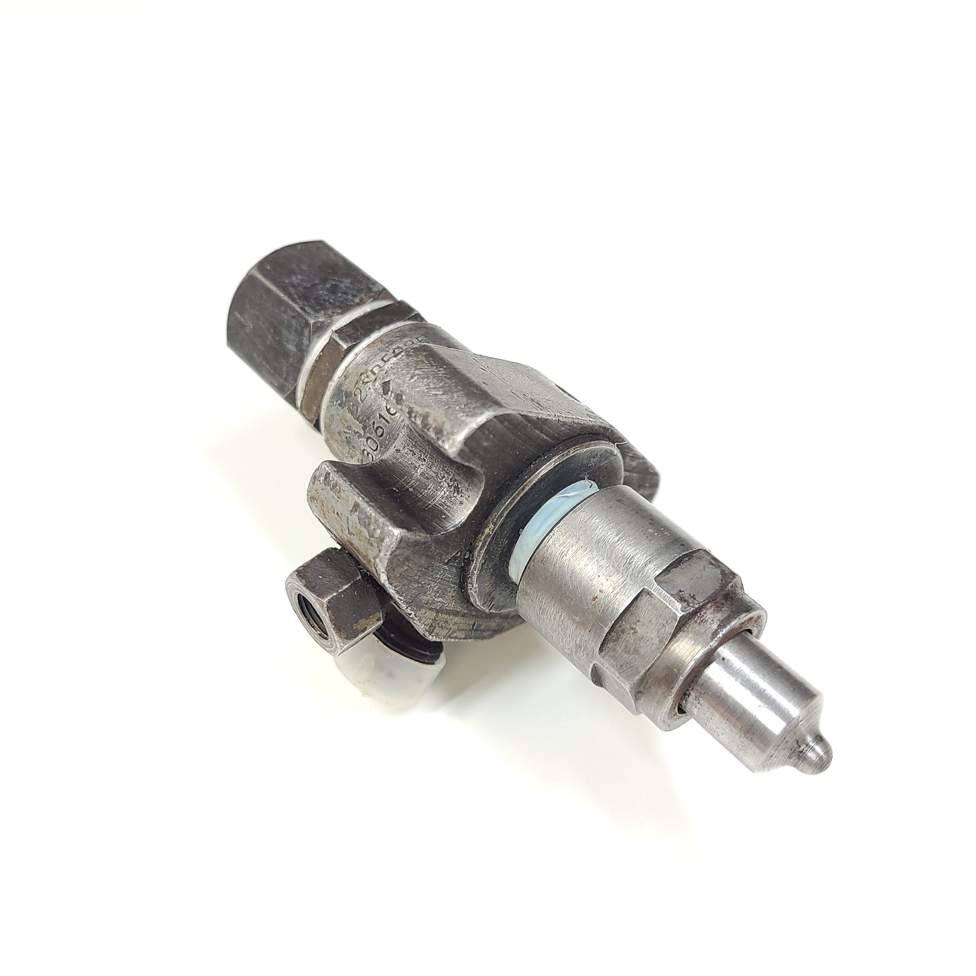 Silver hydraulic valve A3205085 with part marking 5306162 XC and surface wear.