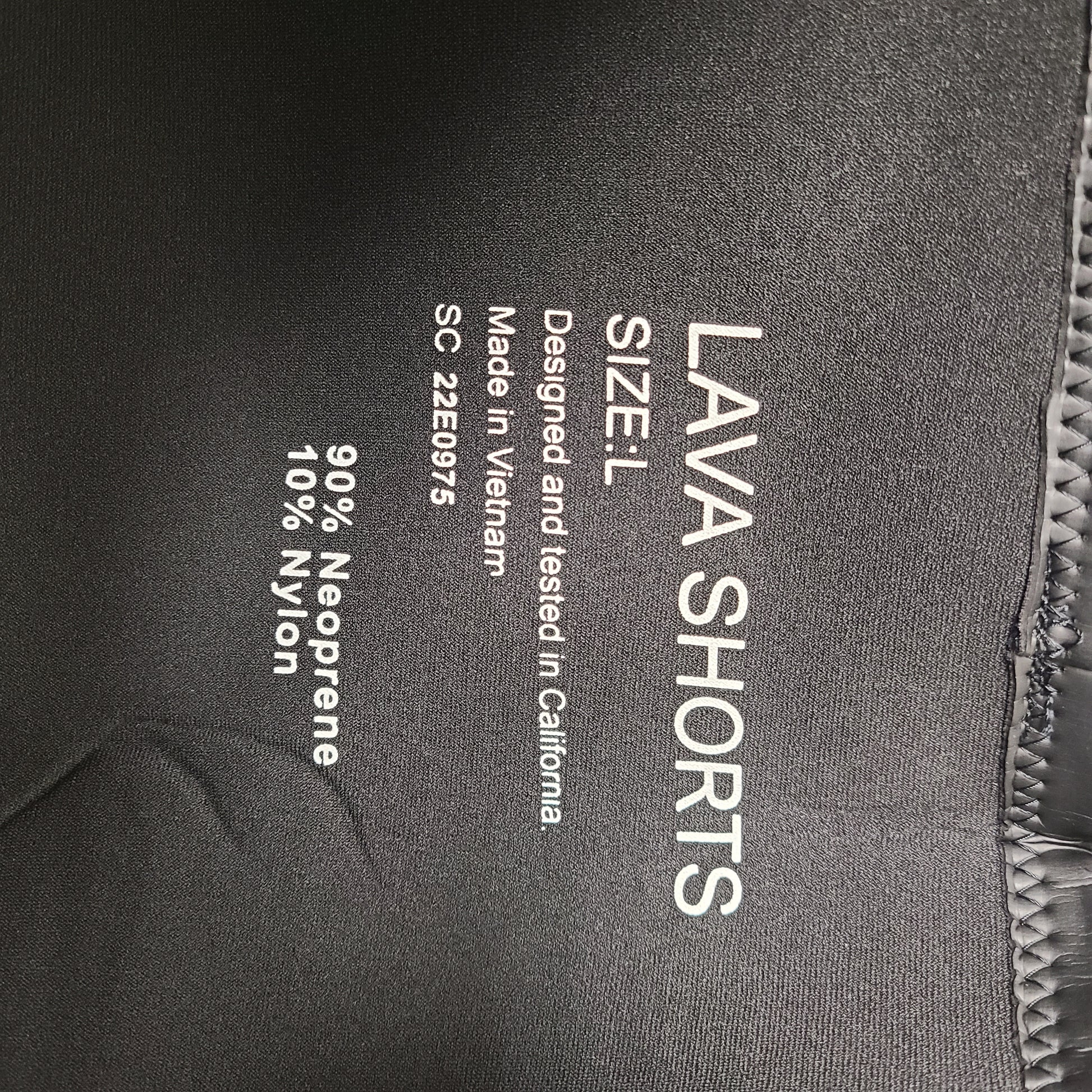 Black and blue Xterra Lava neoprene shorts in size L with nylon panels and reinforced seams.