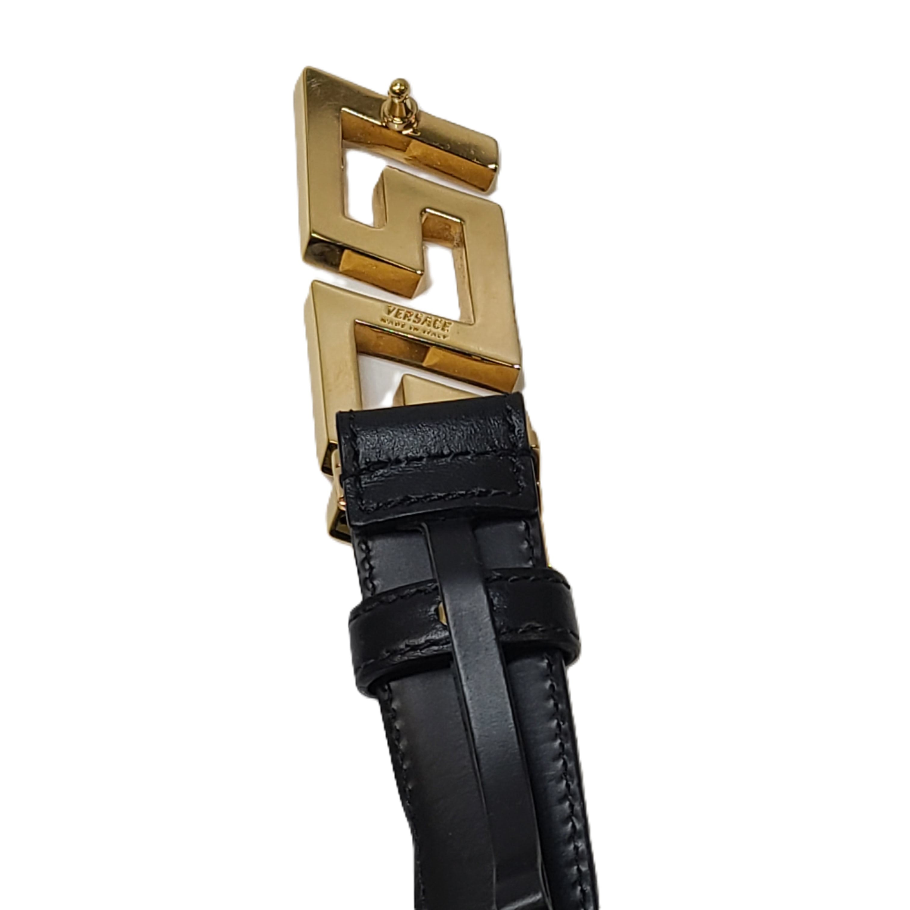 Black Versace leather belt with a gold Medusa buckle, sized 95/38.