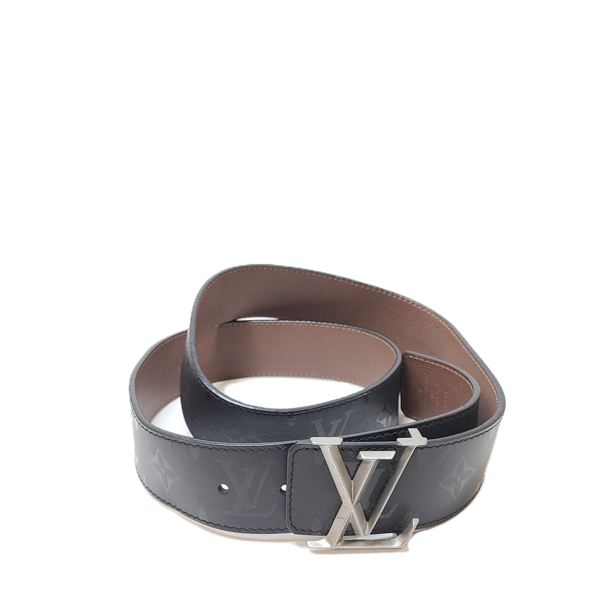 A black Louis Vuitton leather belt with monogram pattern, polished buckle, and Louis Vuitton Paris stamp.