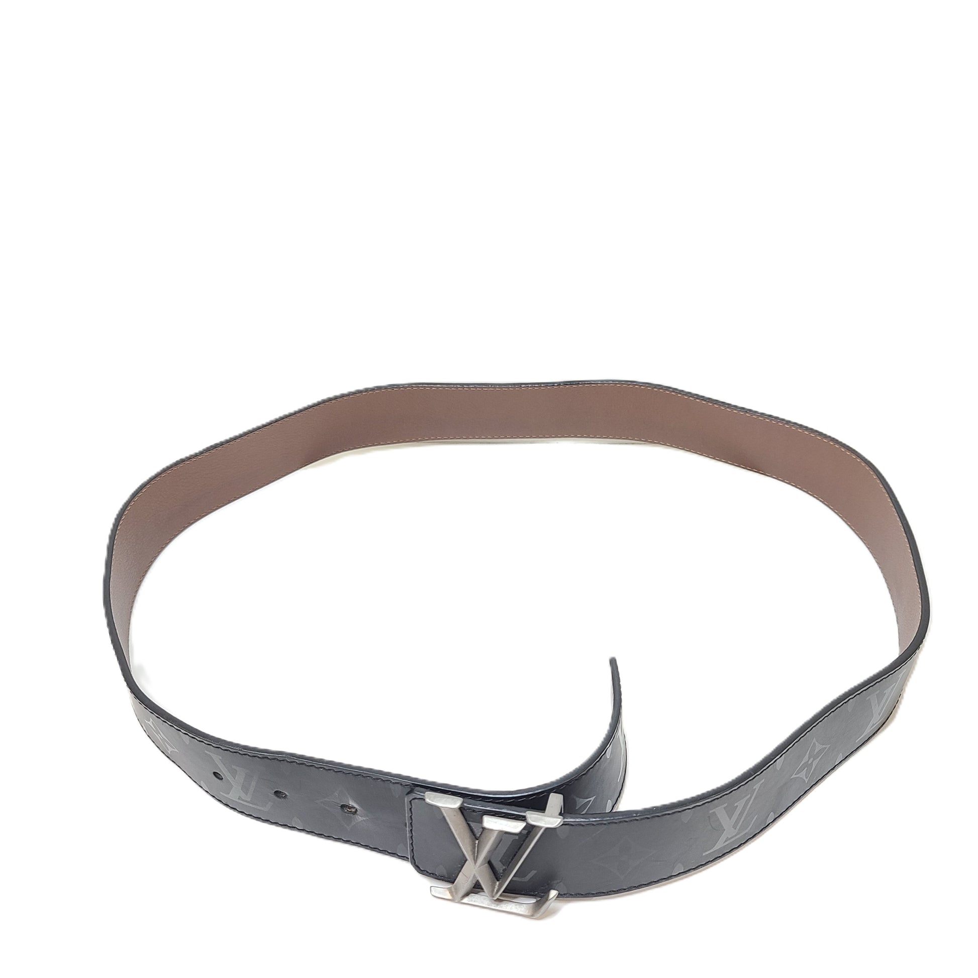 A black Louis Vuitton leather belt with monogram pattern, polished buckle, and Louis Vuitton Paris stamp.