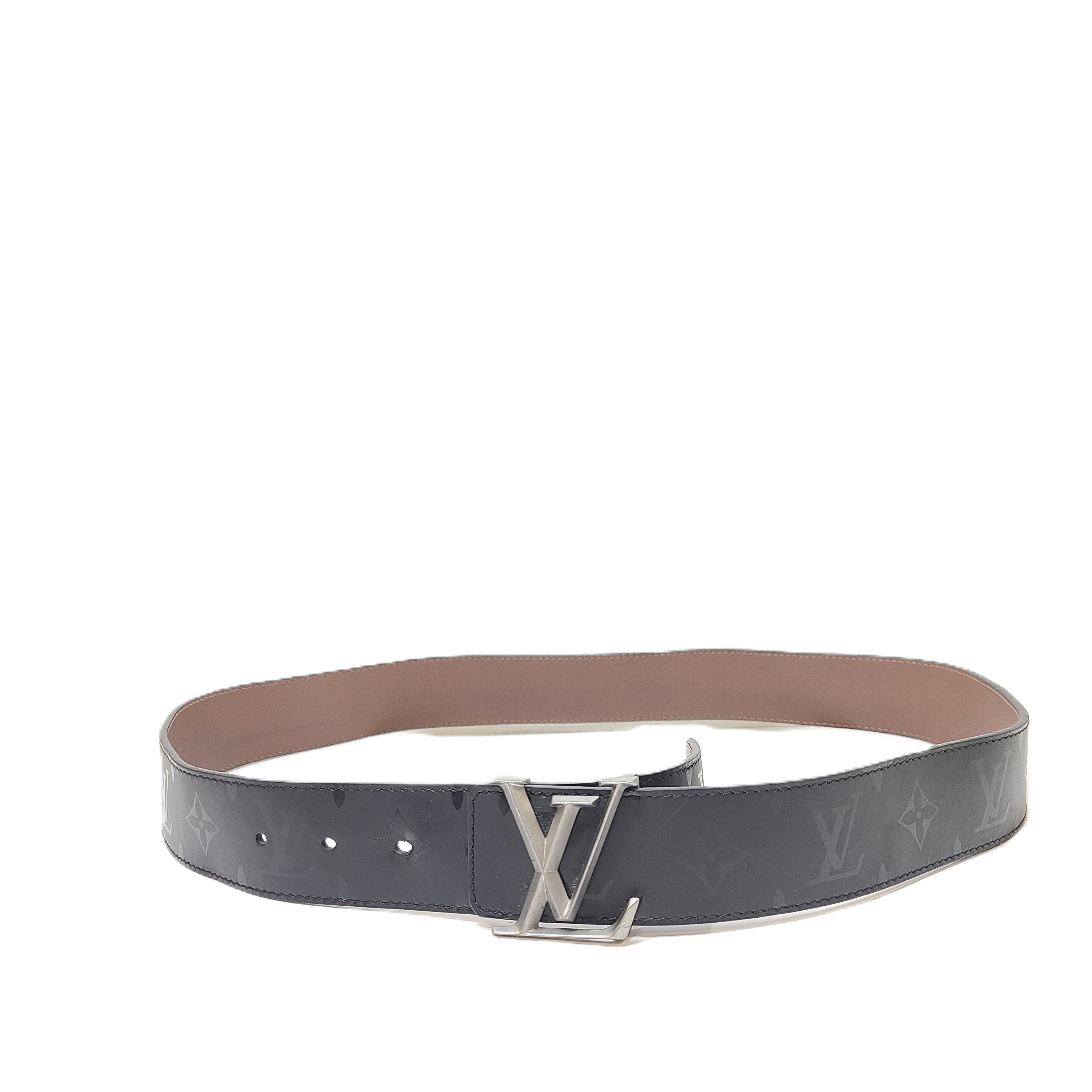 A black Louis Vuitton leather belt with monogram pattern, polished buckle, and Louis Vuitton Paris stamp.