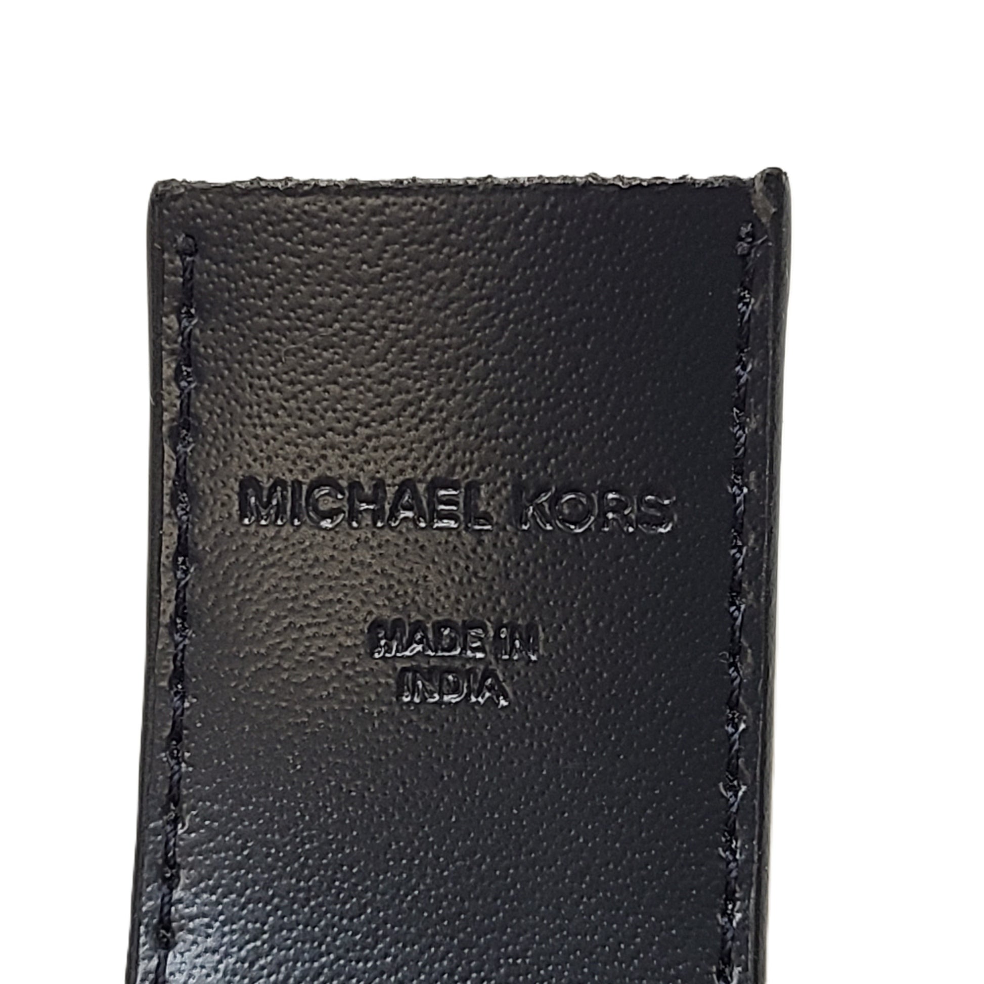 A reversible Michael Kors leather belt in blue and black with an MK logo buckle and a standard buckle.