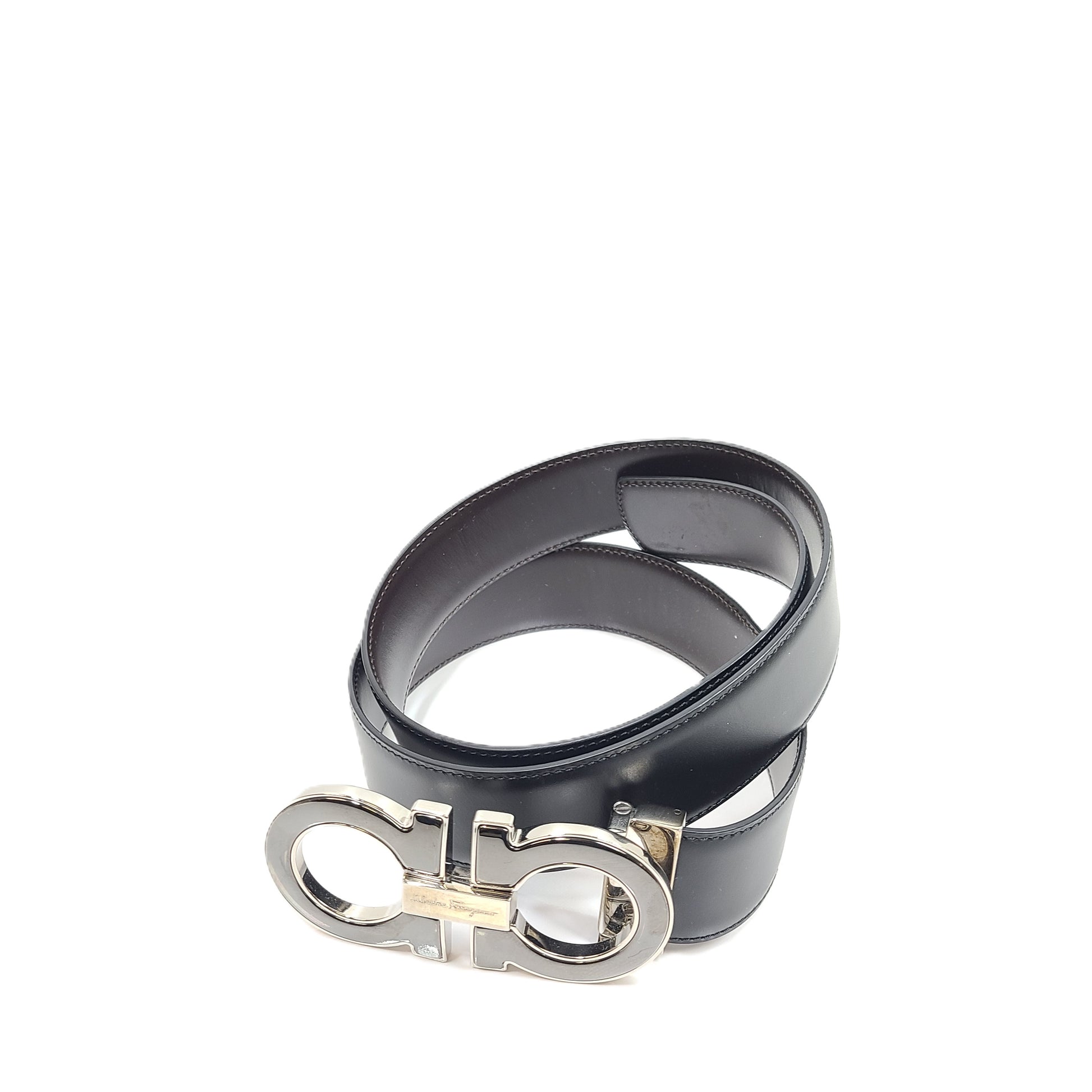 Salvatore Ferragamo black leather belt with refined buckle and Italian craftsmanship.