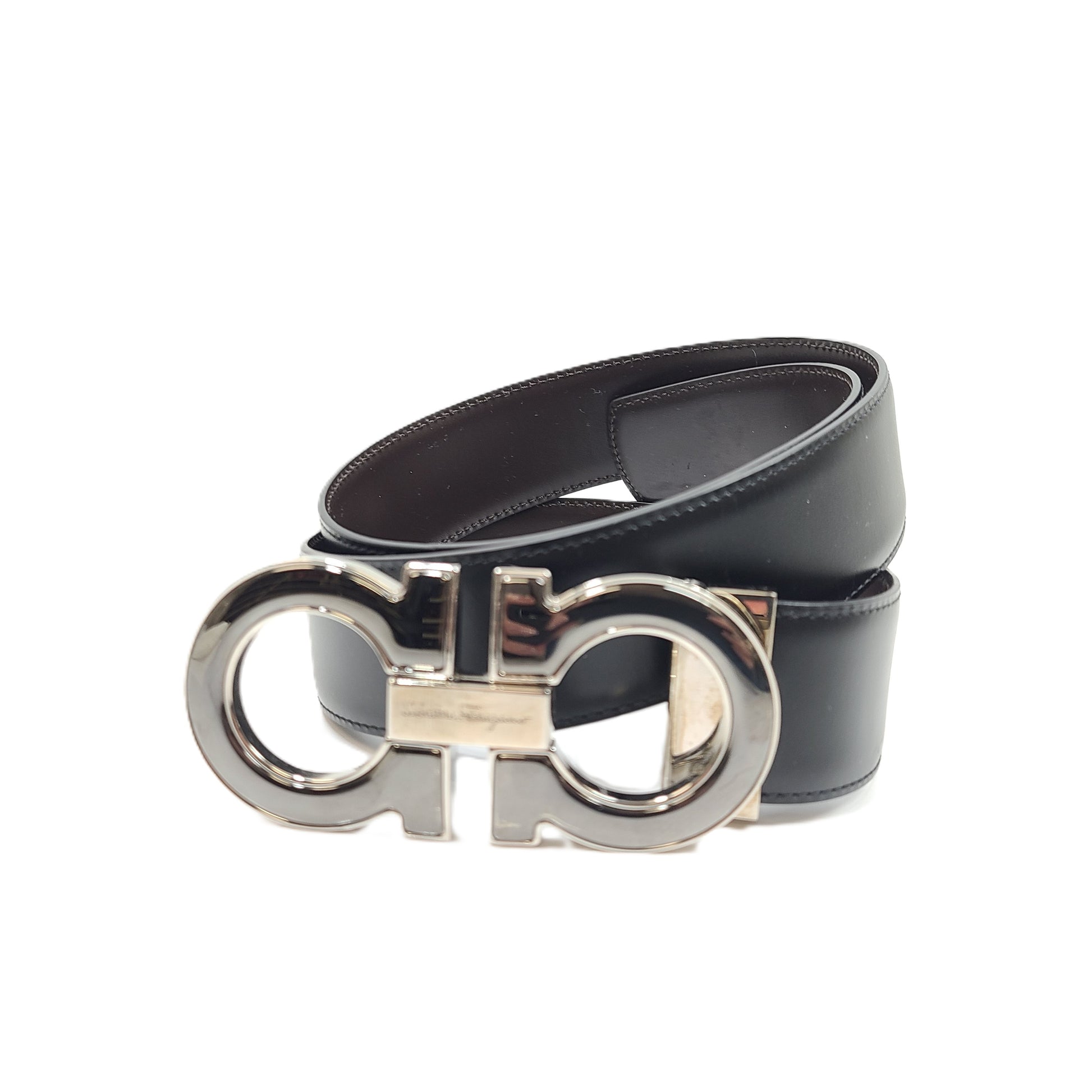 Salvatore Ferragamo black leather belt with refined buckle and Italian craftsmanship.