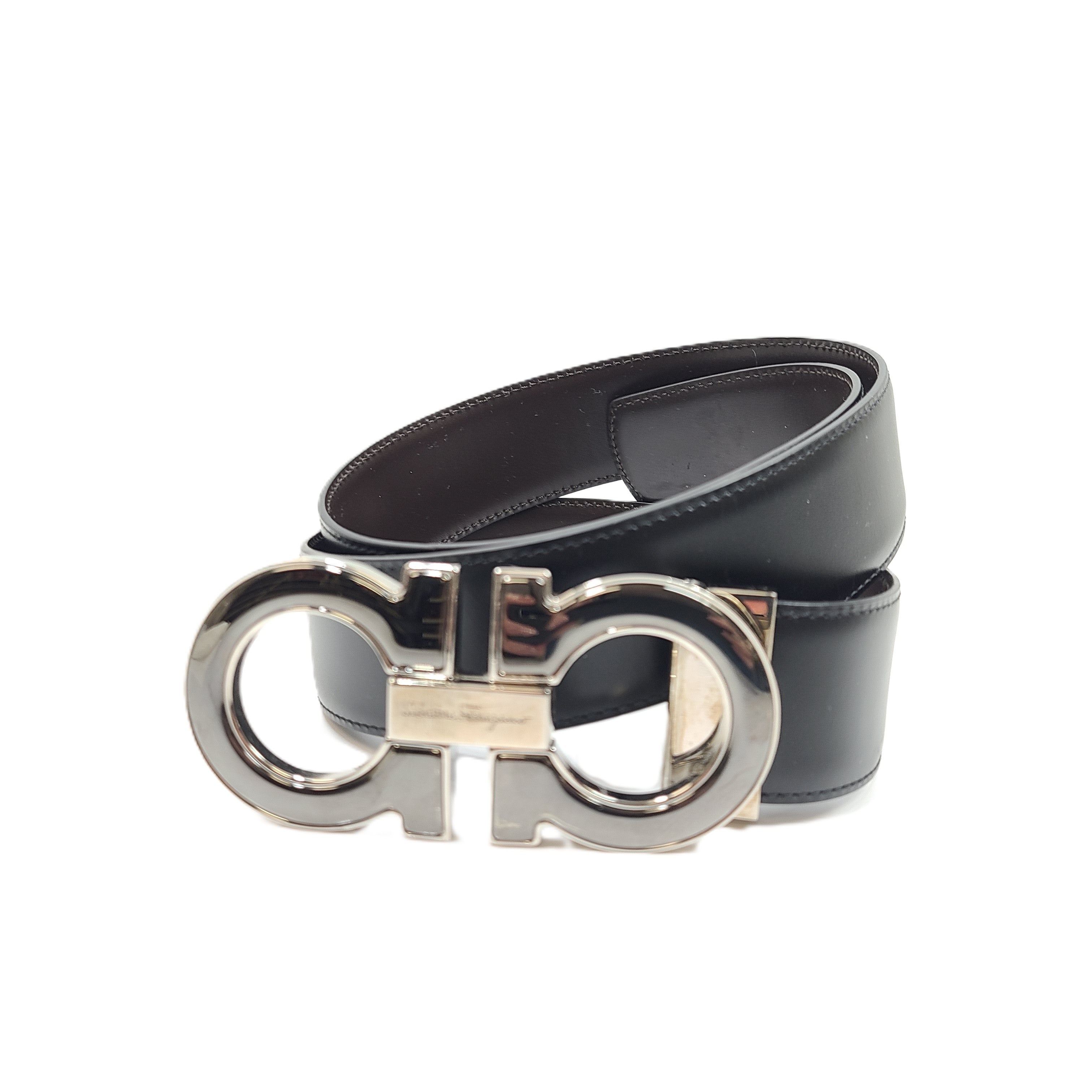 Salvatore Ferragamo black leather belt with refined buckle and Italian craftsmanship.