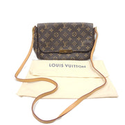 Louis Vuitton Monogram Canvas brown handbag, model DU1165, with classic monogram and leather trim.