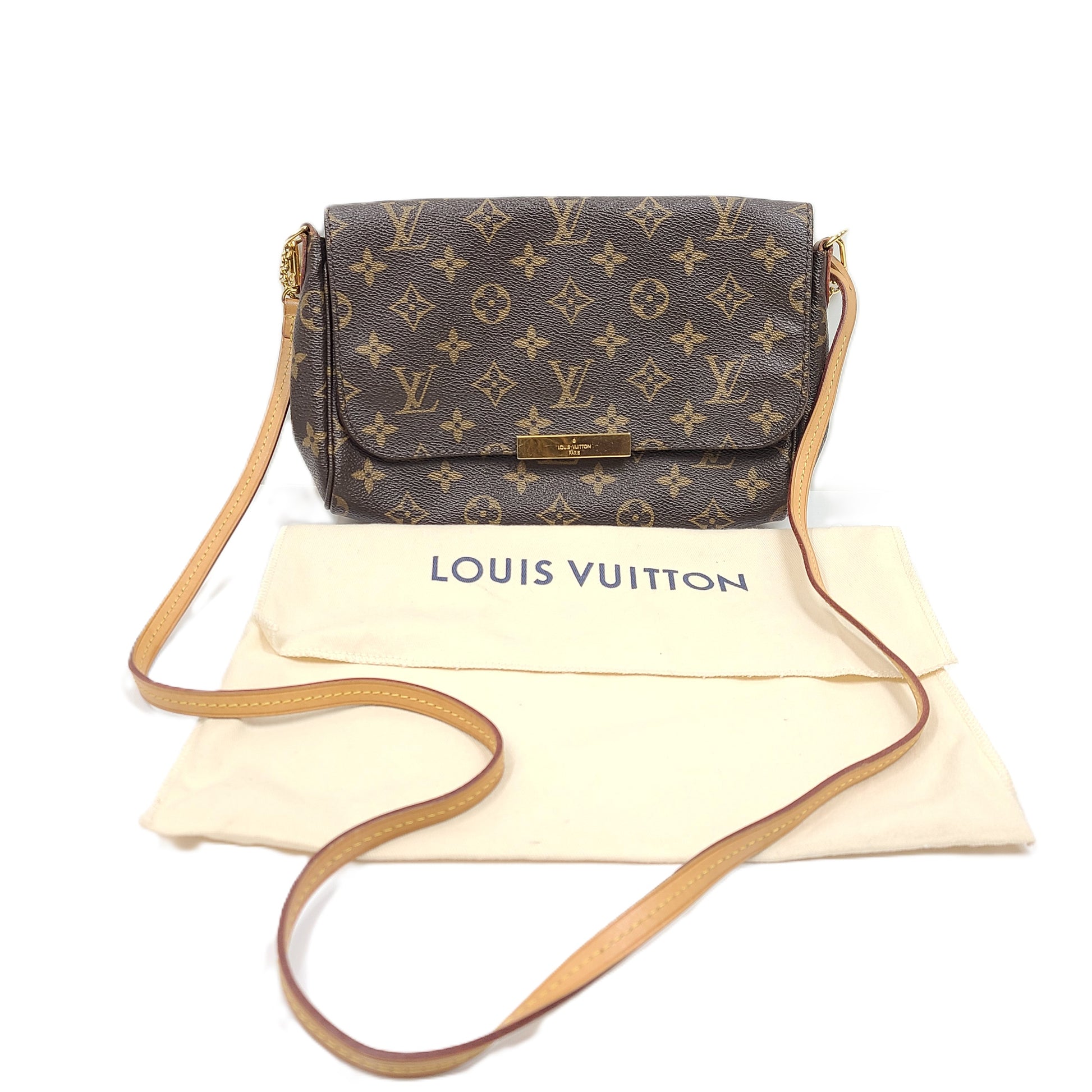 Louis Vuitton Monogram Canvas brown handbag, model DU1165, with classic monogram and leather trim.