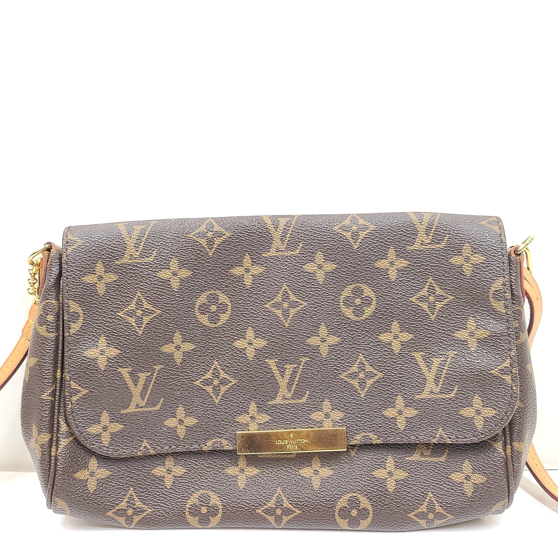 Louis Vuitton Monogram Canvas brown handbag, model DU1165, with classic monogram and leather trim.