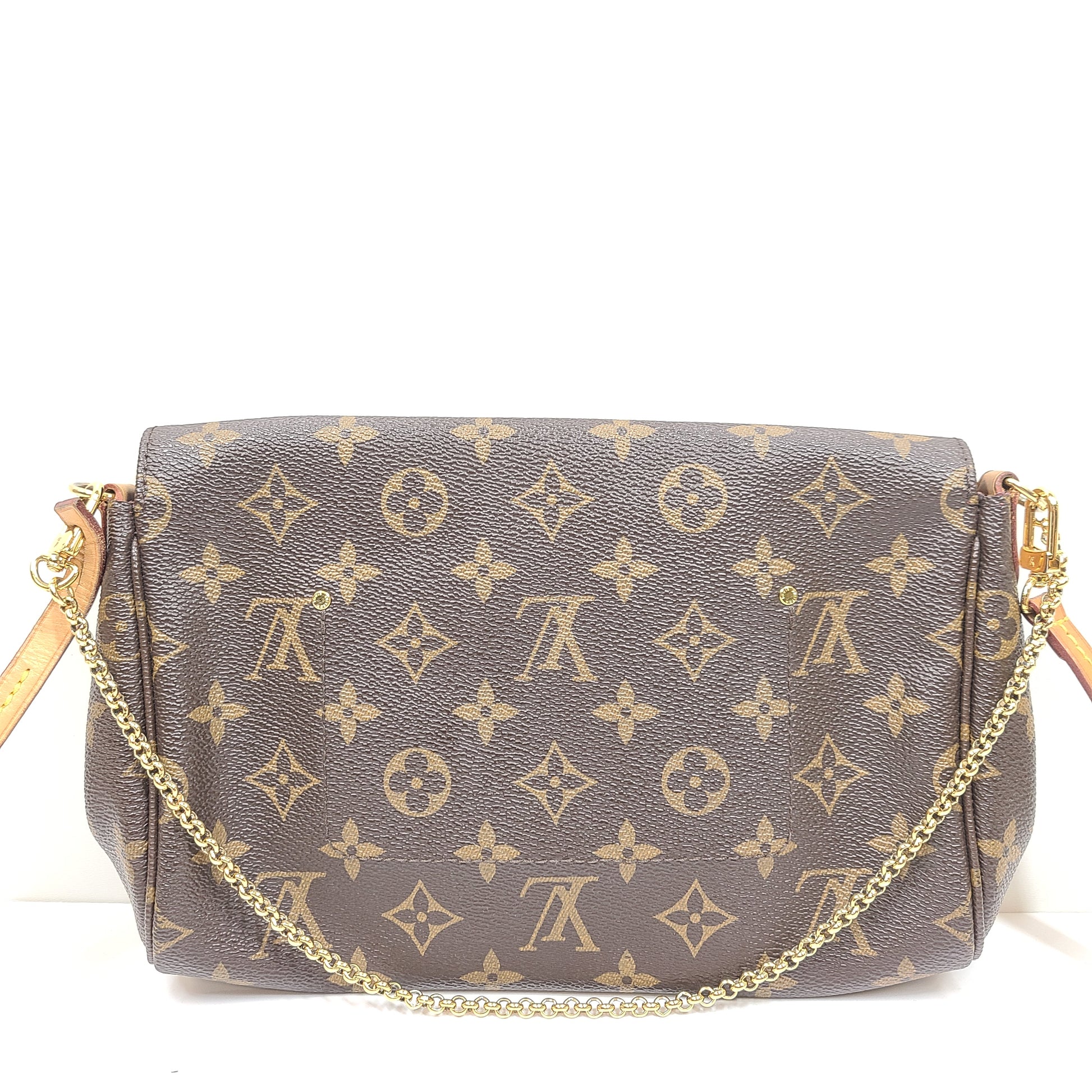 Louis Vuitton Monogram Canvas brown handbag, model DU1165, with classic monogram and leather trim.