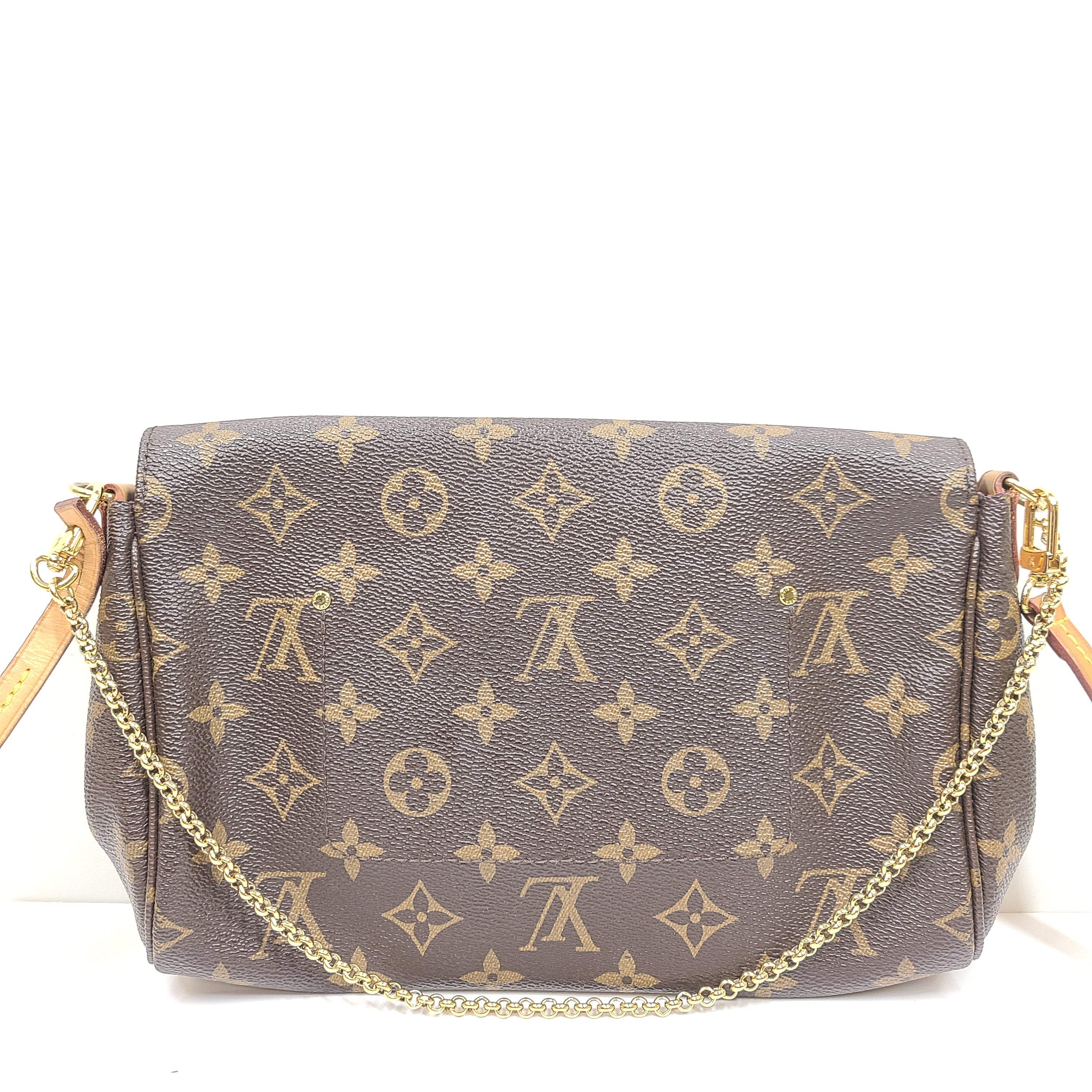 Louis Vuitton Monogram Canvas brown handbag, model DU1165, with classic monogram and leather trim.