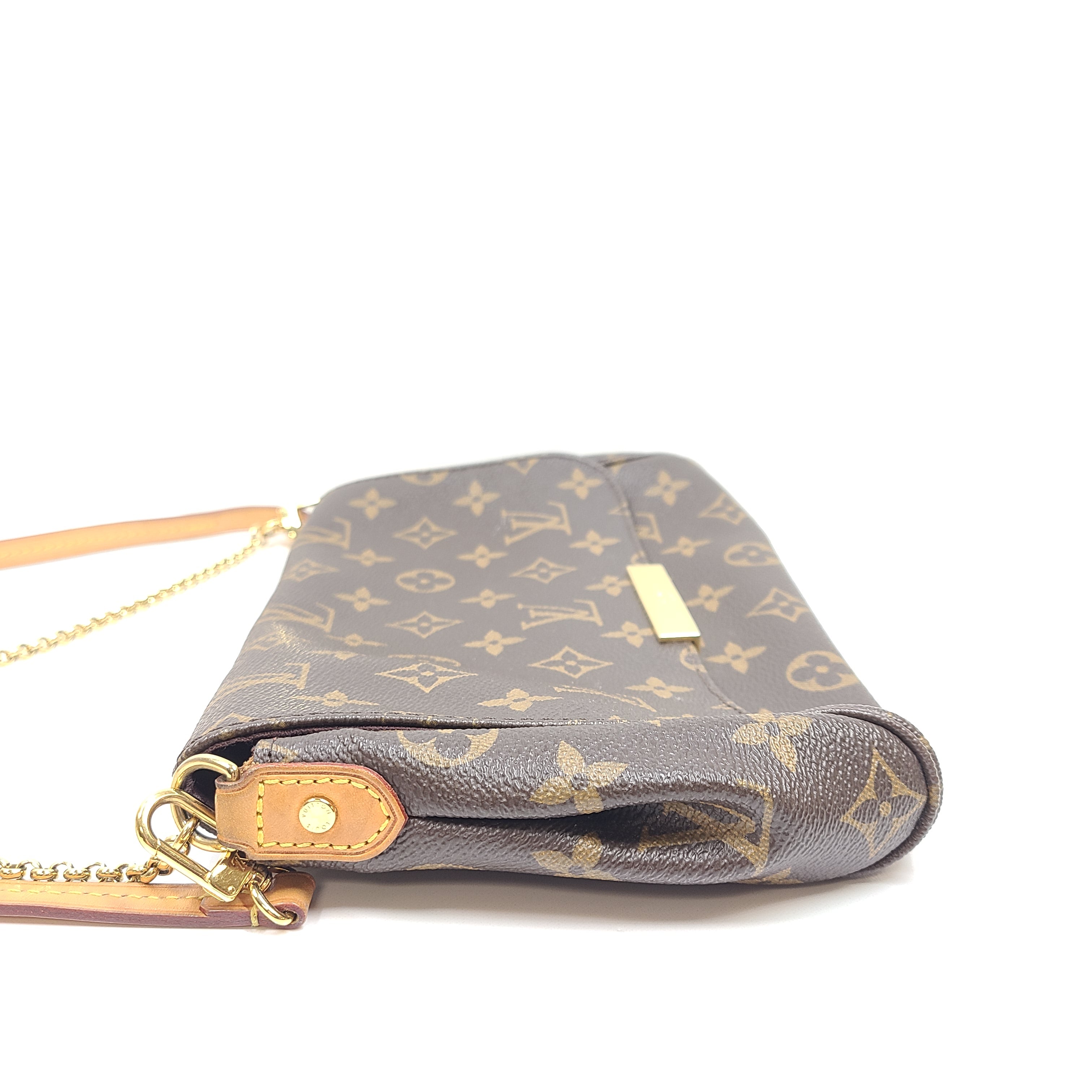 Louis Vuitton Monogram Canvas brown handbag, model DU1165, with classic monogram and leather trim.