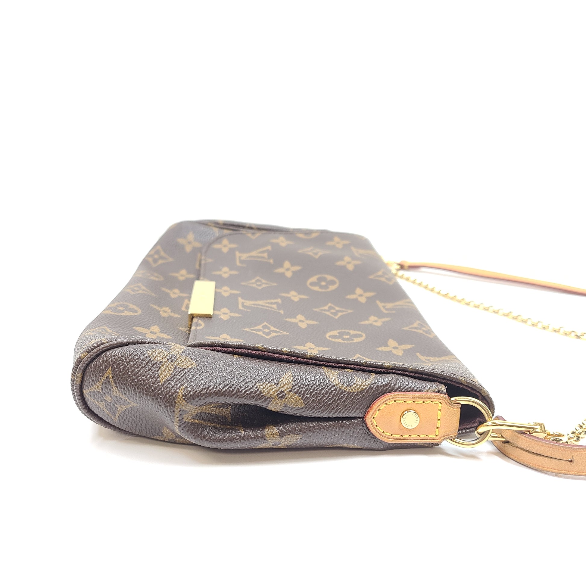 Louis Vuitton Monogram Canvas brown handbag, model DU1165, with classic monogram and leather trim.
