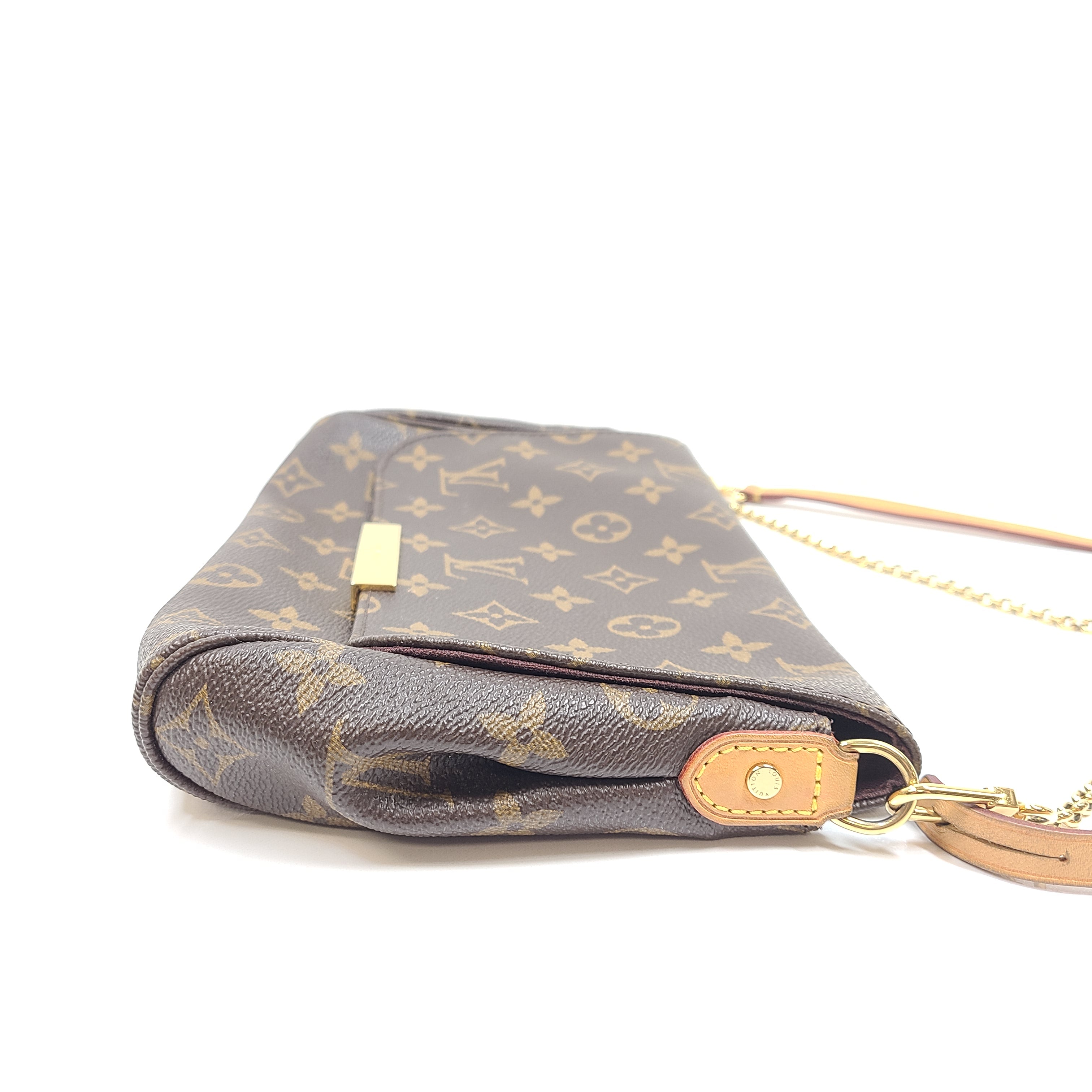 Louis Vuitton Monogram Canvas brown handbag, model DU1165, with classic monogram and leather trim.