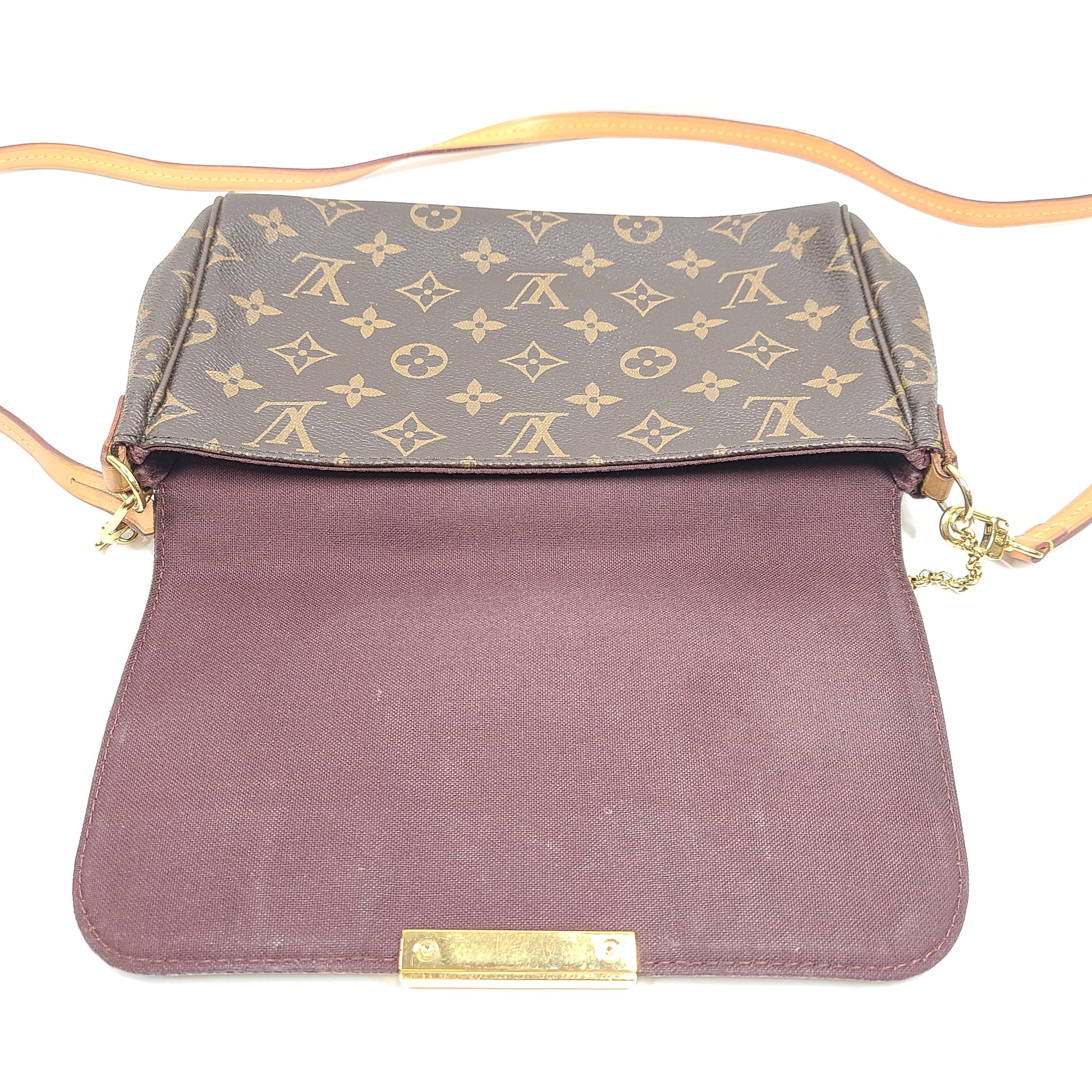 Louis Vuitton Monogram Canvas brown handbag, model DU1165, with classic monogram and leather trim.