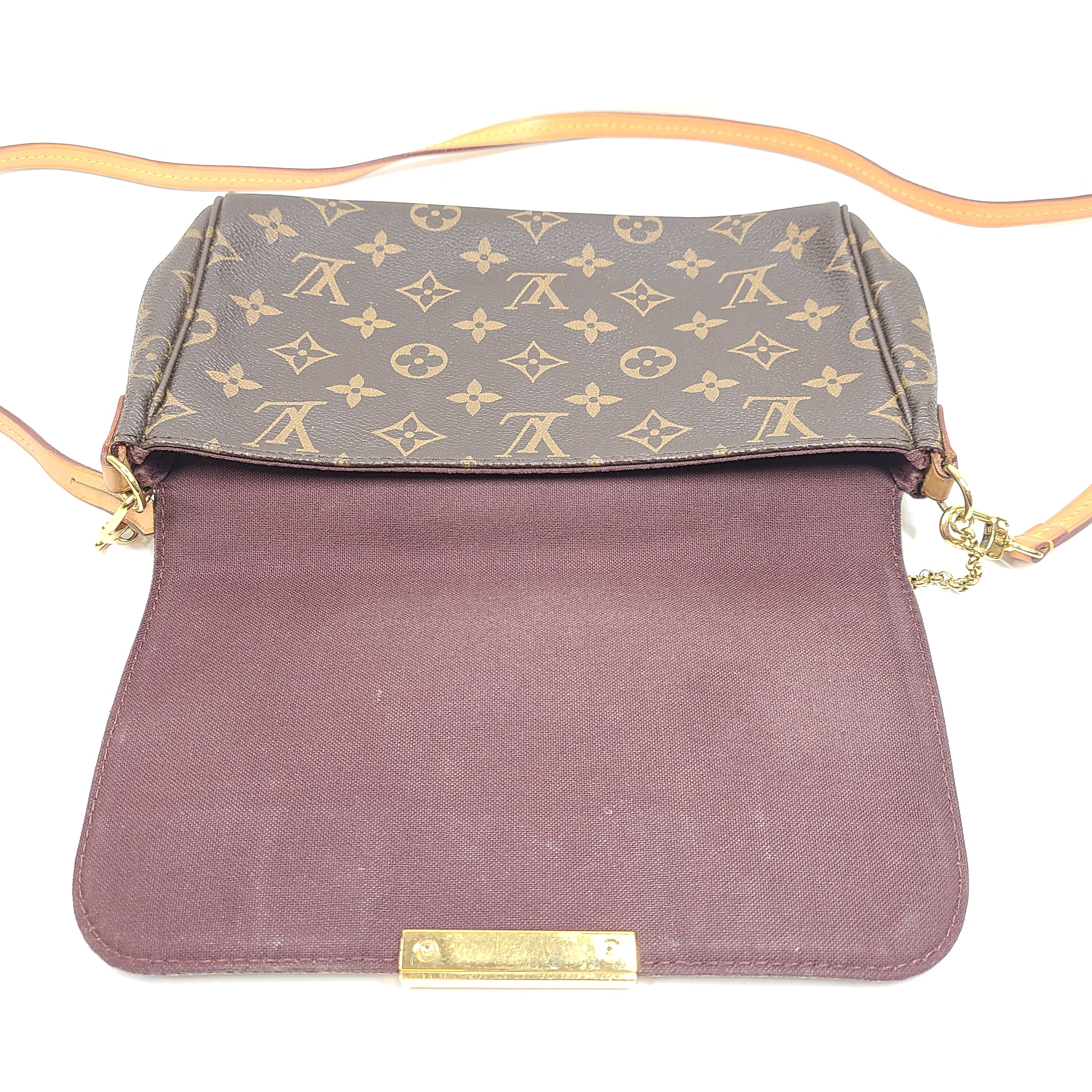 Louis Vuitton Monogram Canvas brown handbag, model DU1165, with classic monogram and leather trim.