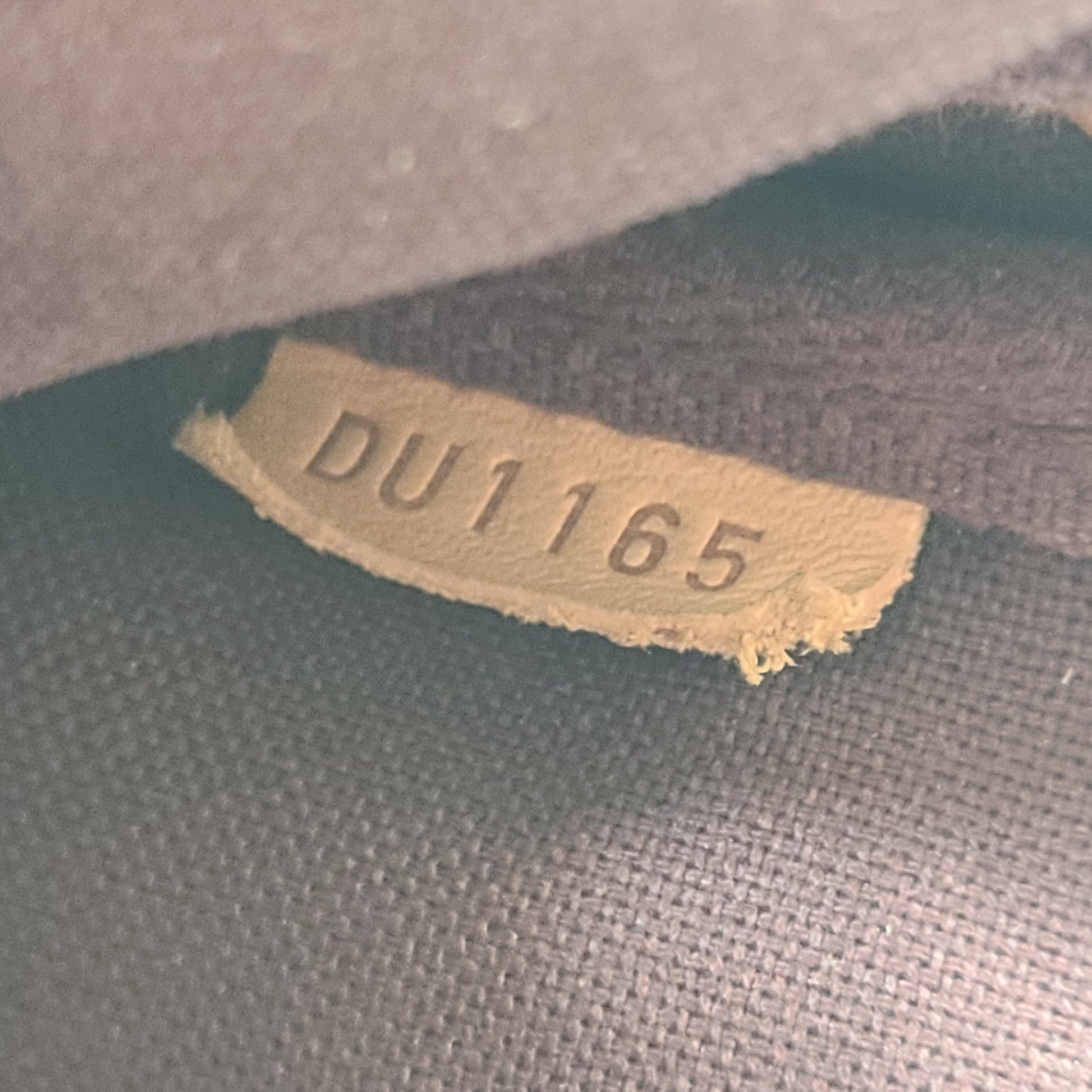 Louis Vuitton Monogram Canvas brown handbag, model DU1165, with classic monogram and leather trim.