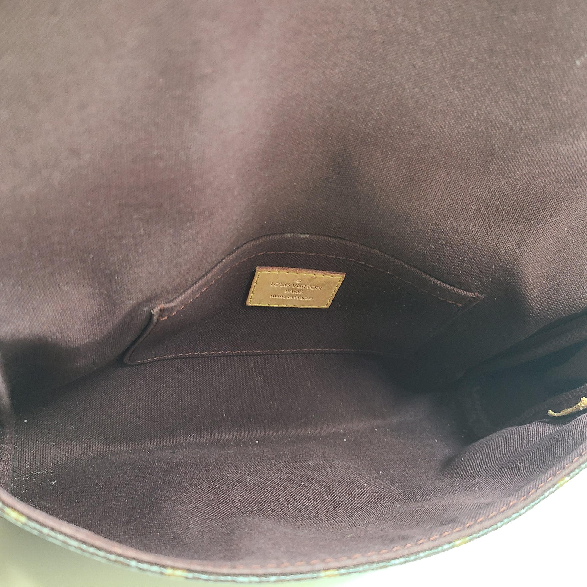 Louis Vuitton Monogram Canvas brown handbag, model DU1165, with classic monogram and leather trim.