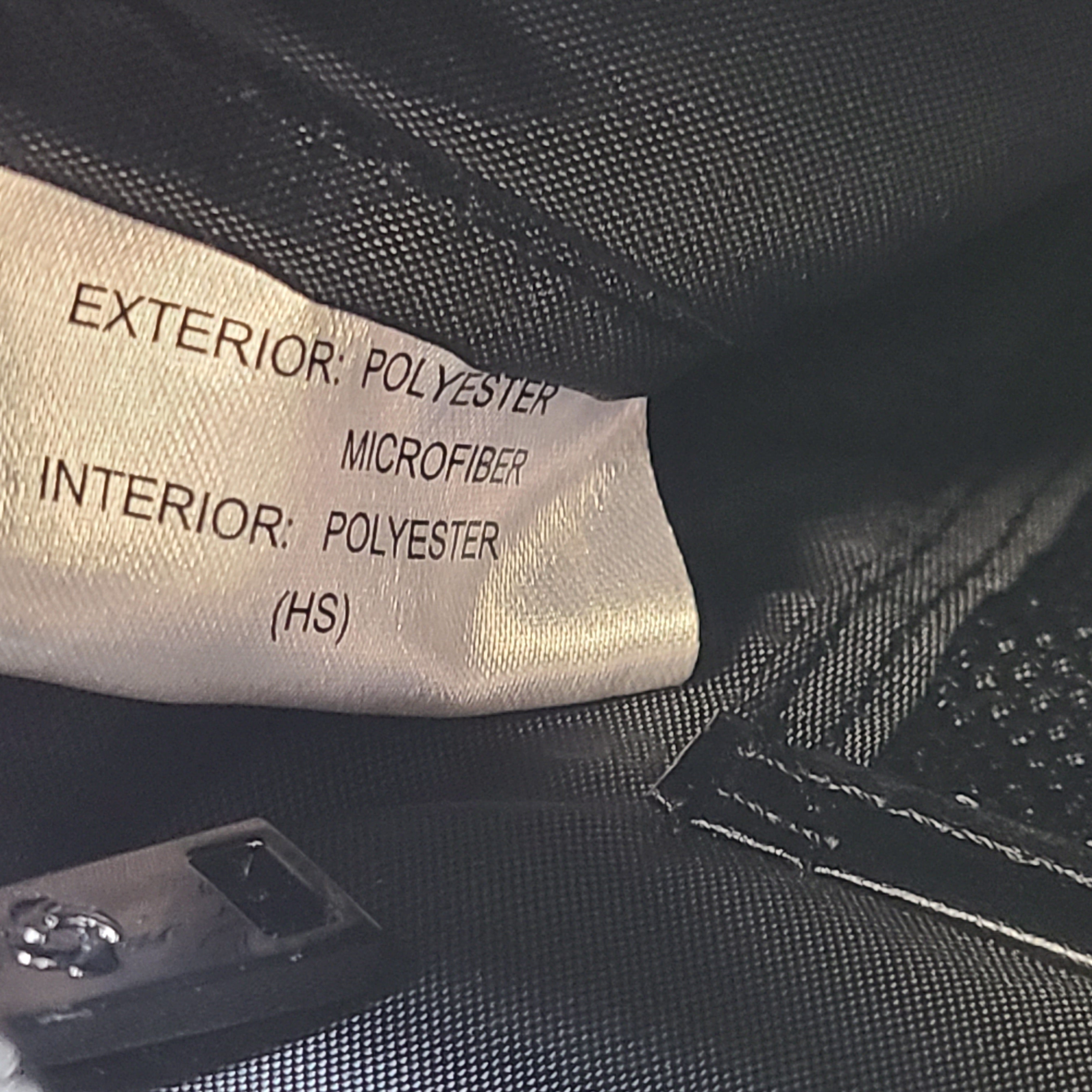 Black Samsonite laptop bag crafted from polyester and microfiber with a slim travel profile and padded laptop compartment.