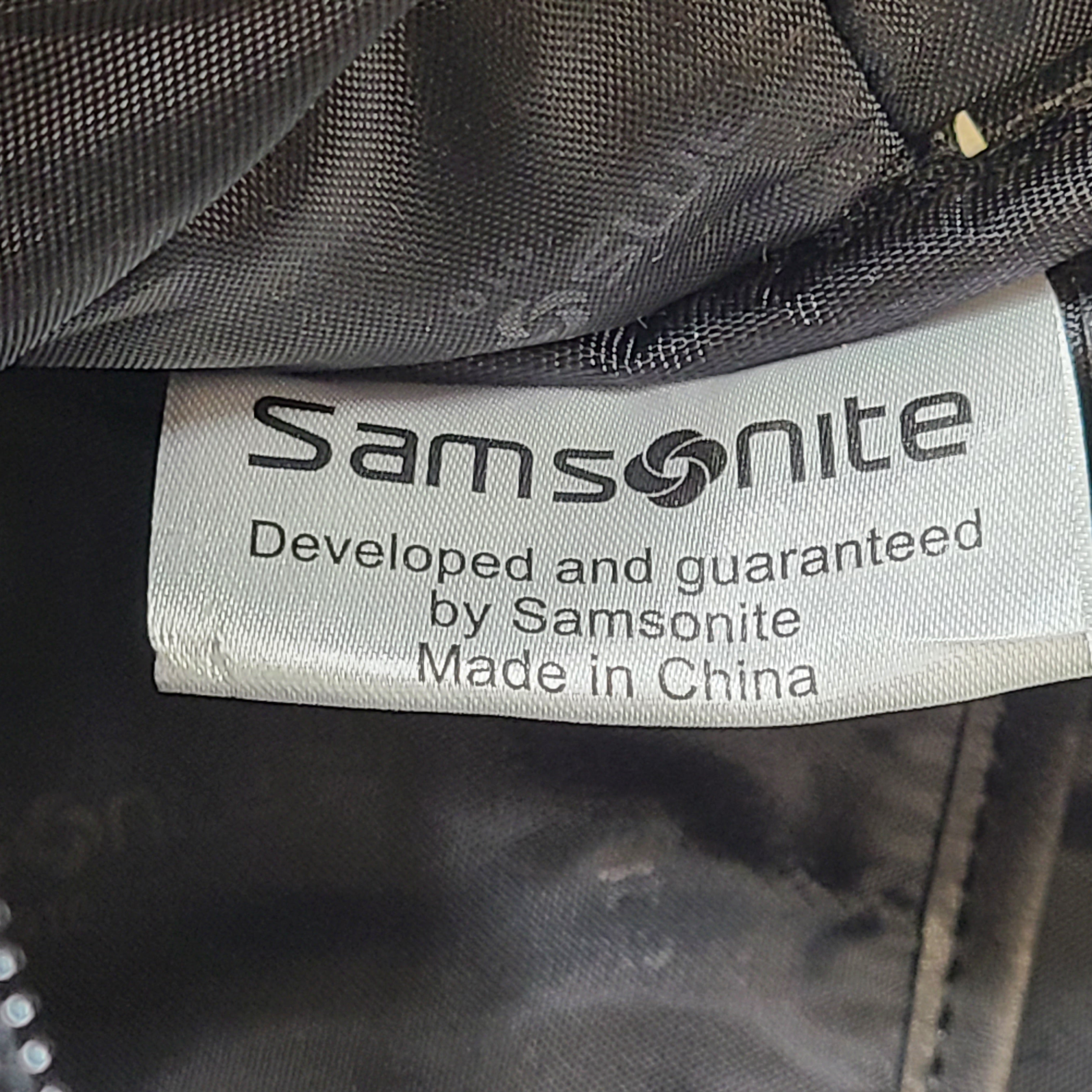 Black Samsonite laptop bag crafted from polyester and microfiber with a slim travel profile and padded laptop compartment.