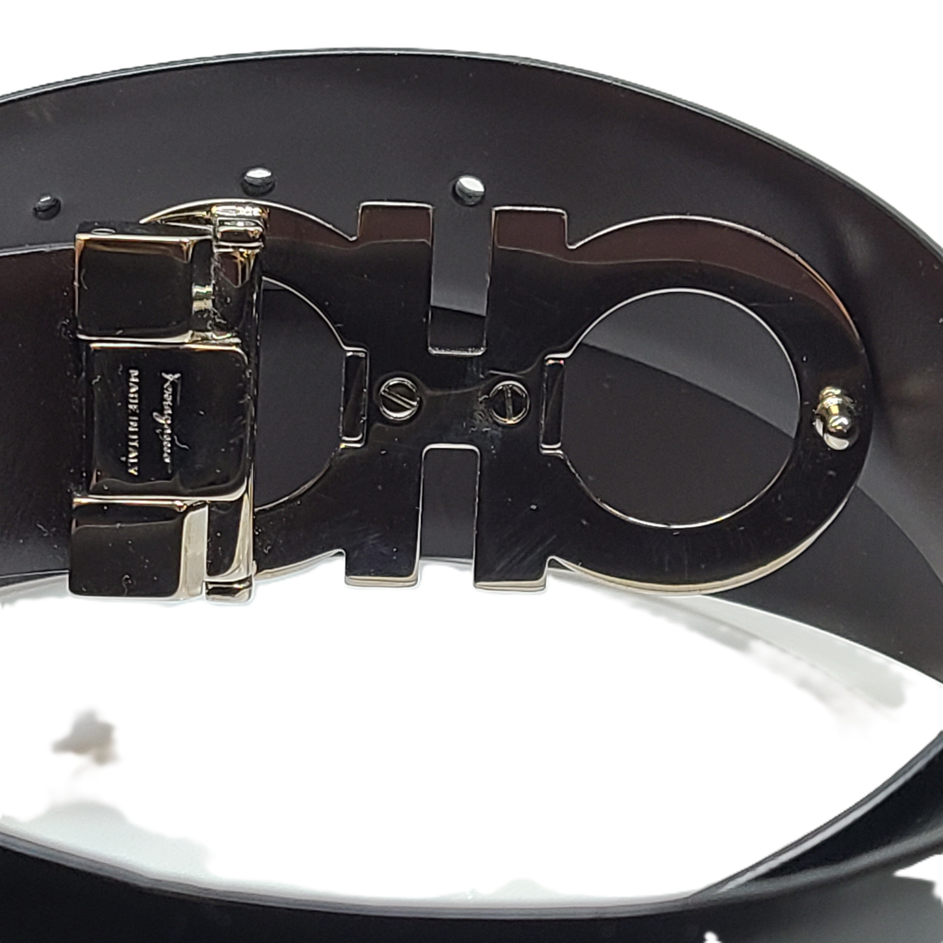 Black Salvatore Ferragamo leather belt that conveys refined Italian craftsmanship and modern elegance.