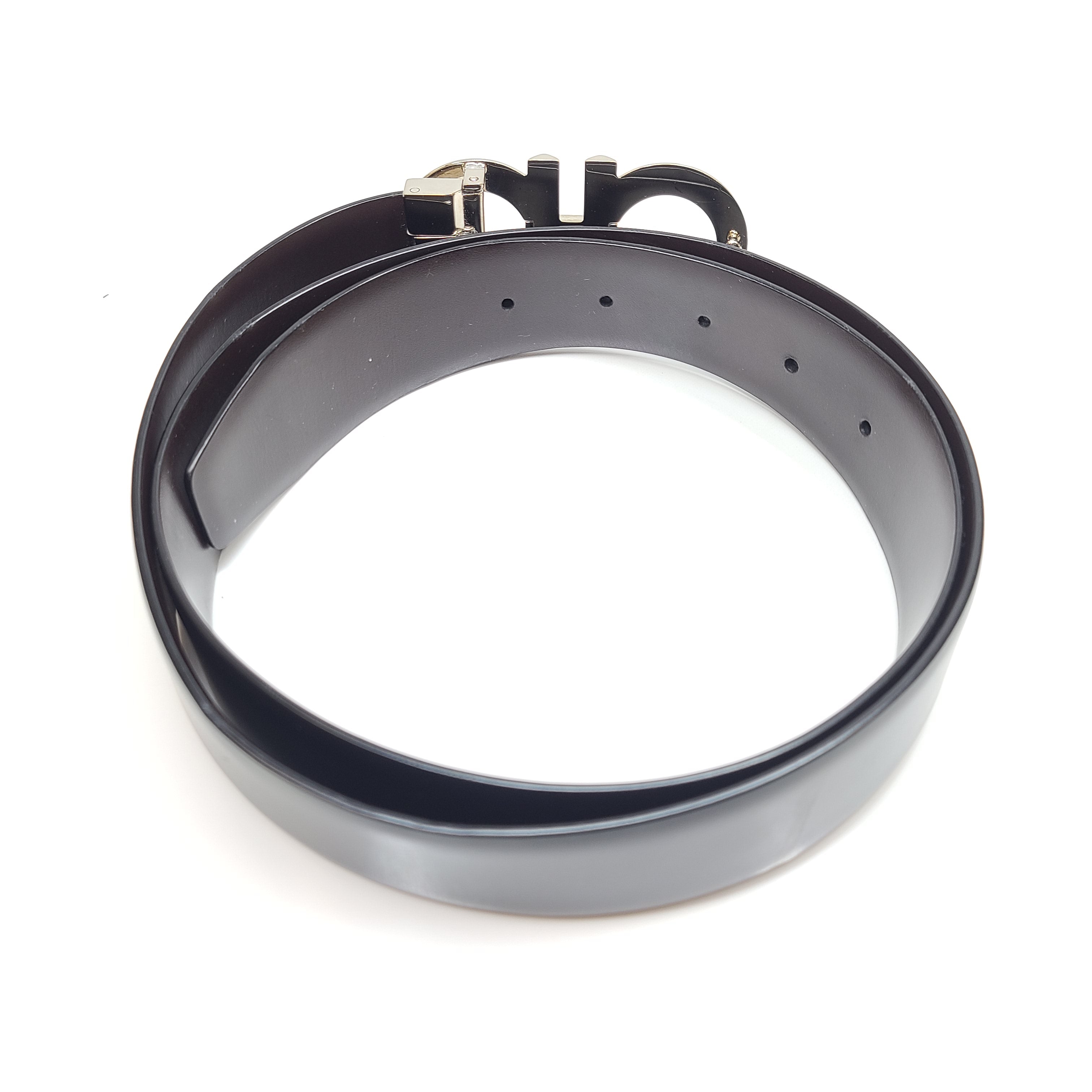 Black Salvatore Ferragamo leather belt that conveys refined Italian craftsmanship and modern elegance.