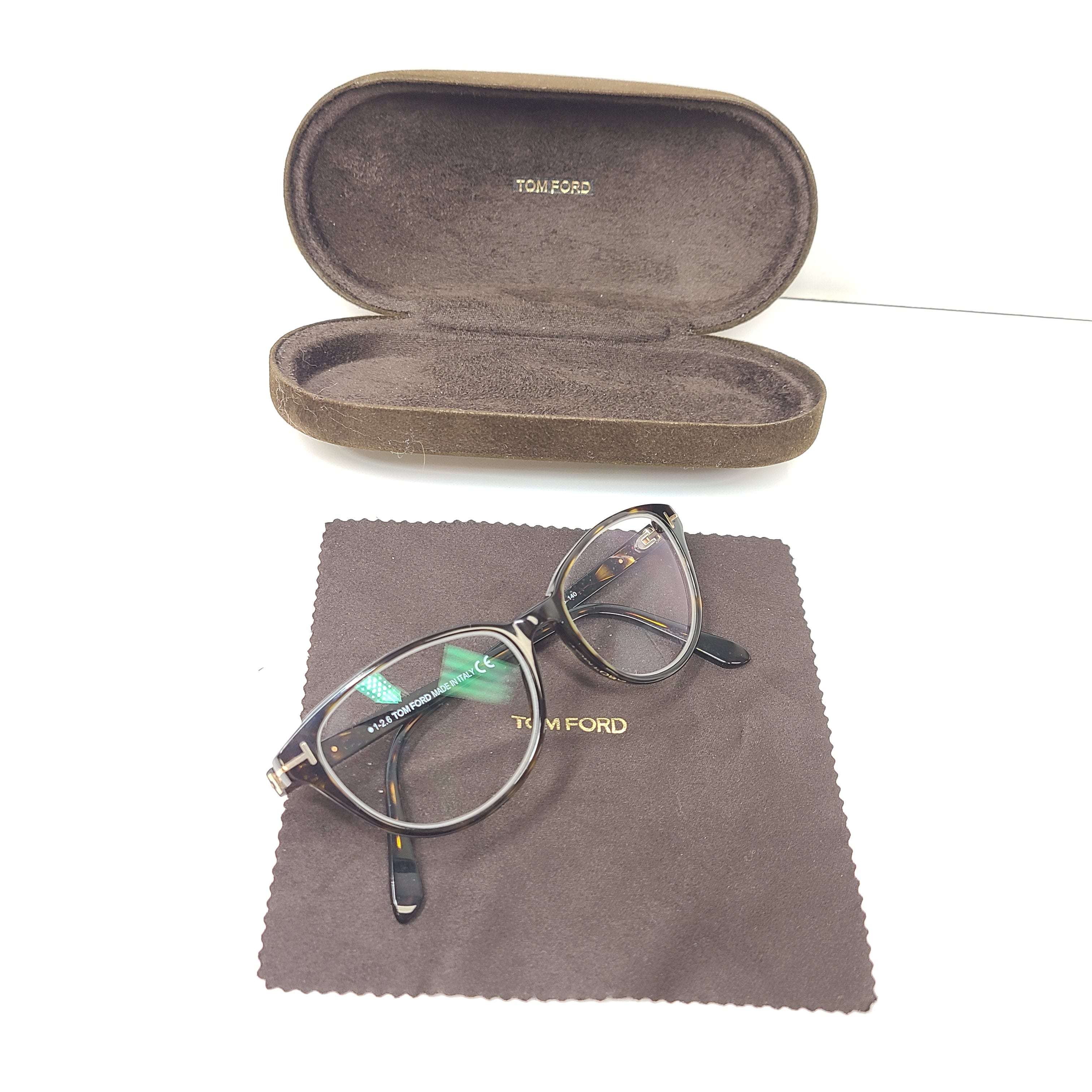 Classic Tom Ford tortoise optical frames in a 53mm size with refined Italian construction.