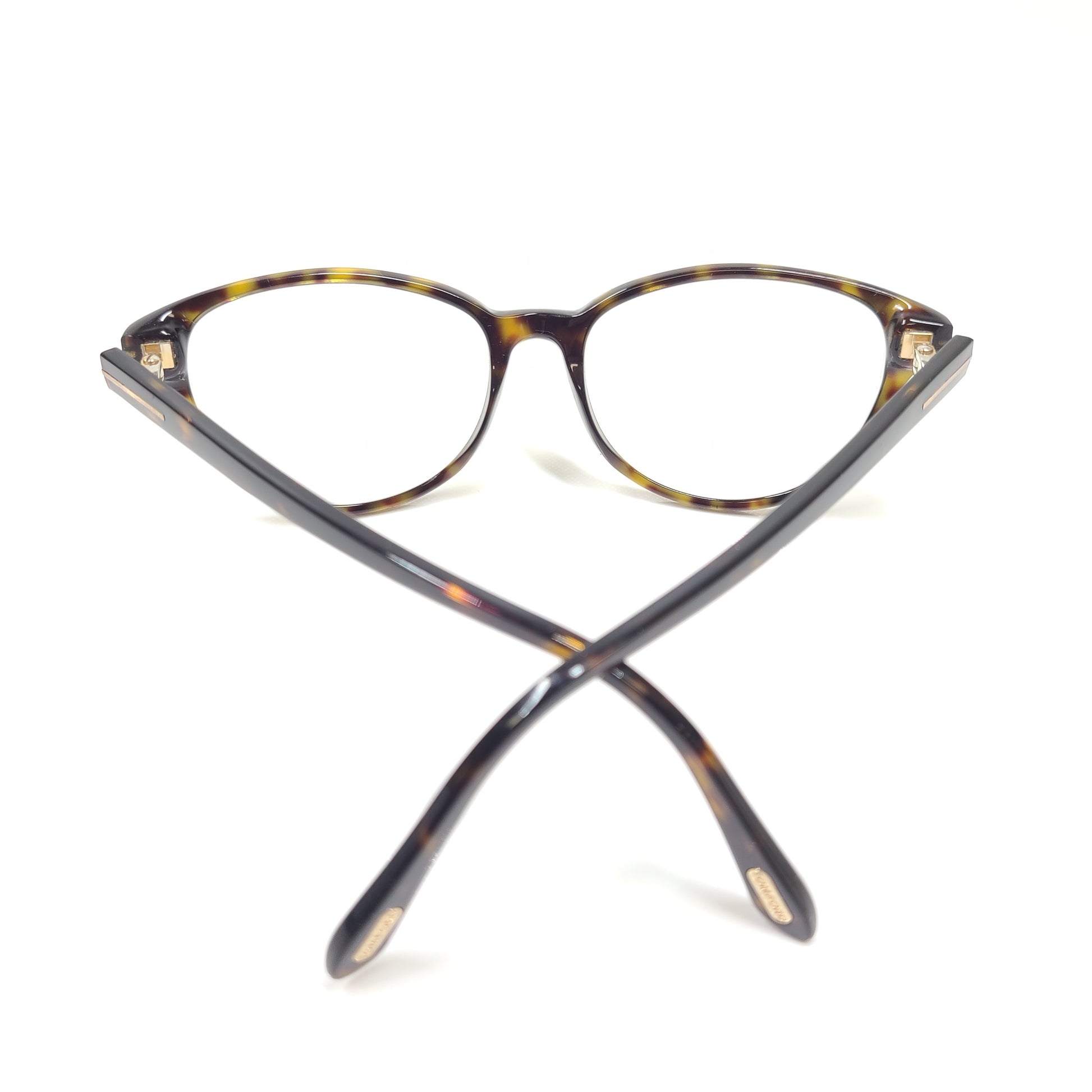 Classic Tom Ford tortoise optical frames in a 53mm size with refined Italian construction.