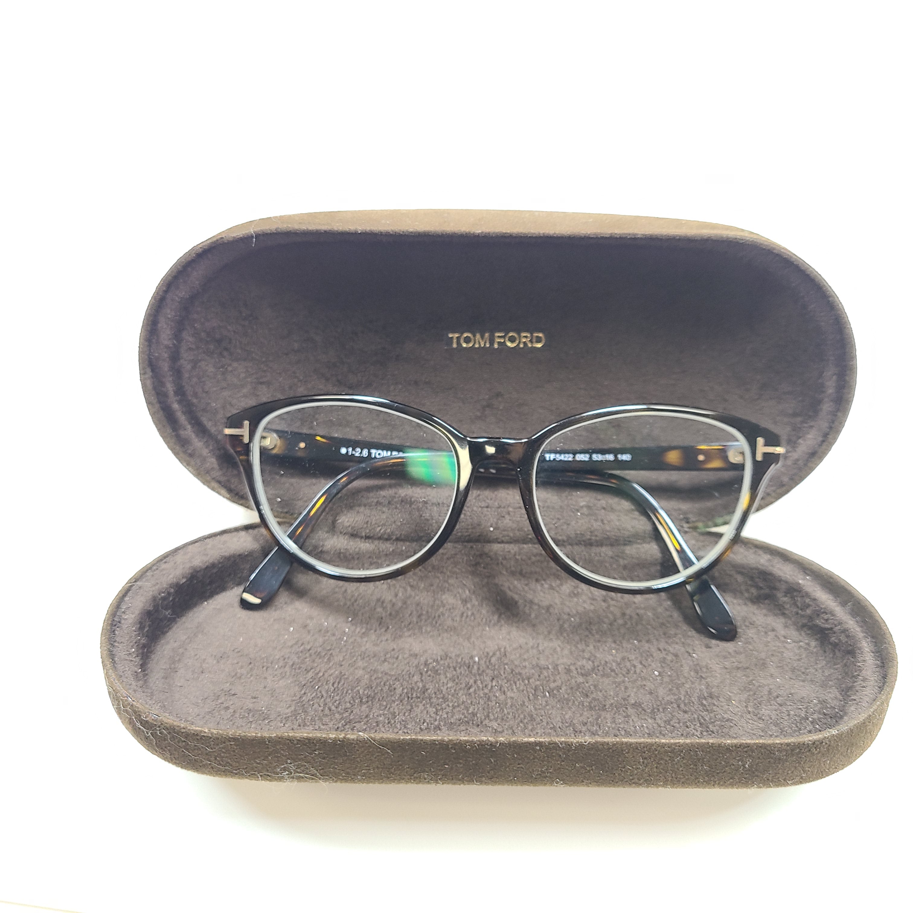 Classic Tom Ford tortoise optical frames in a 53mm size with refined Italian construction.