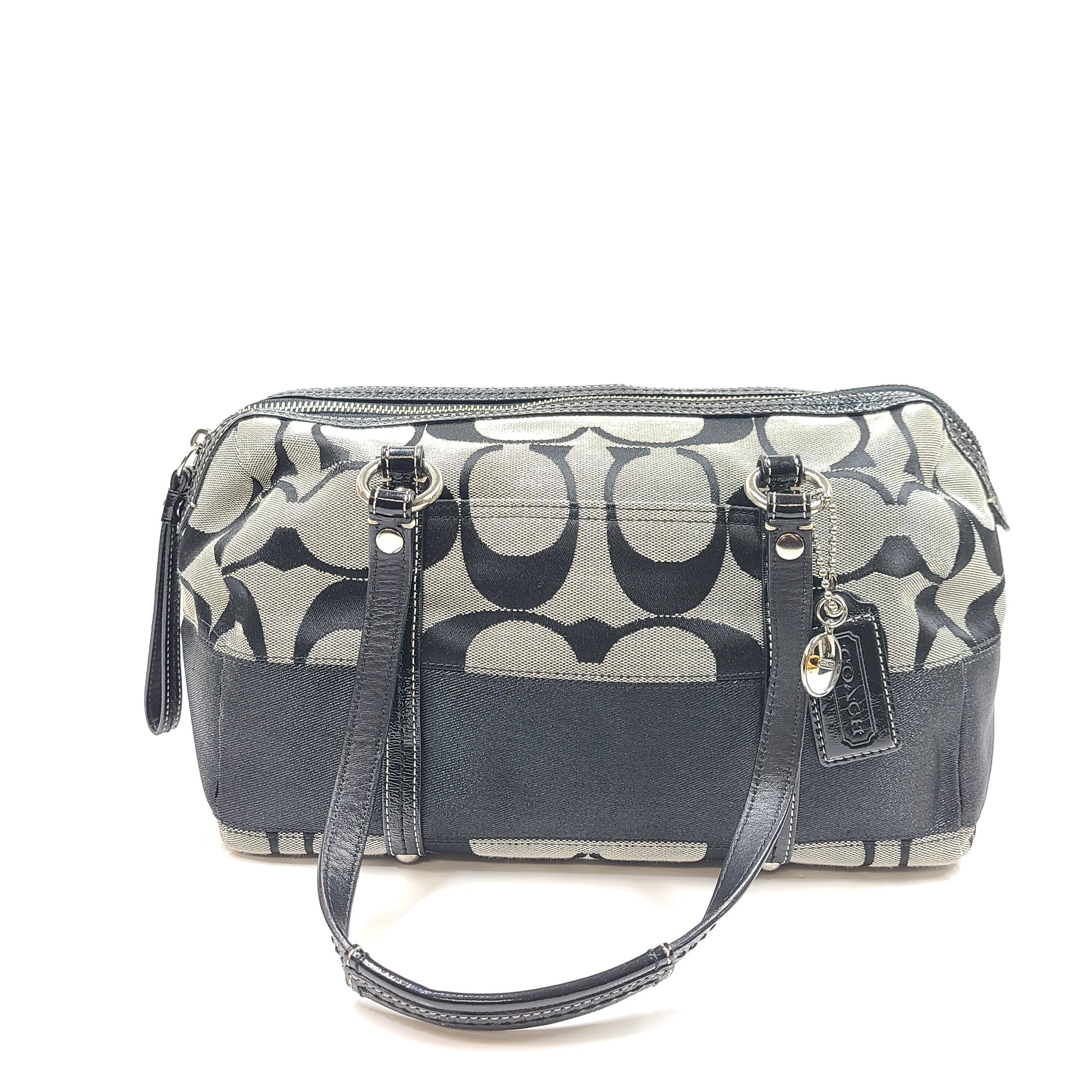 Gray and black Coach satchel with double handles, zip closure, and an interior patch stating handcrafted Coach leather.