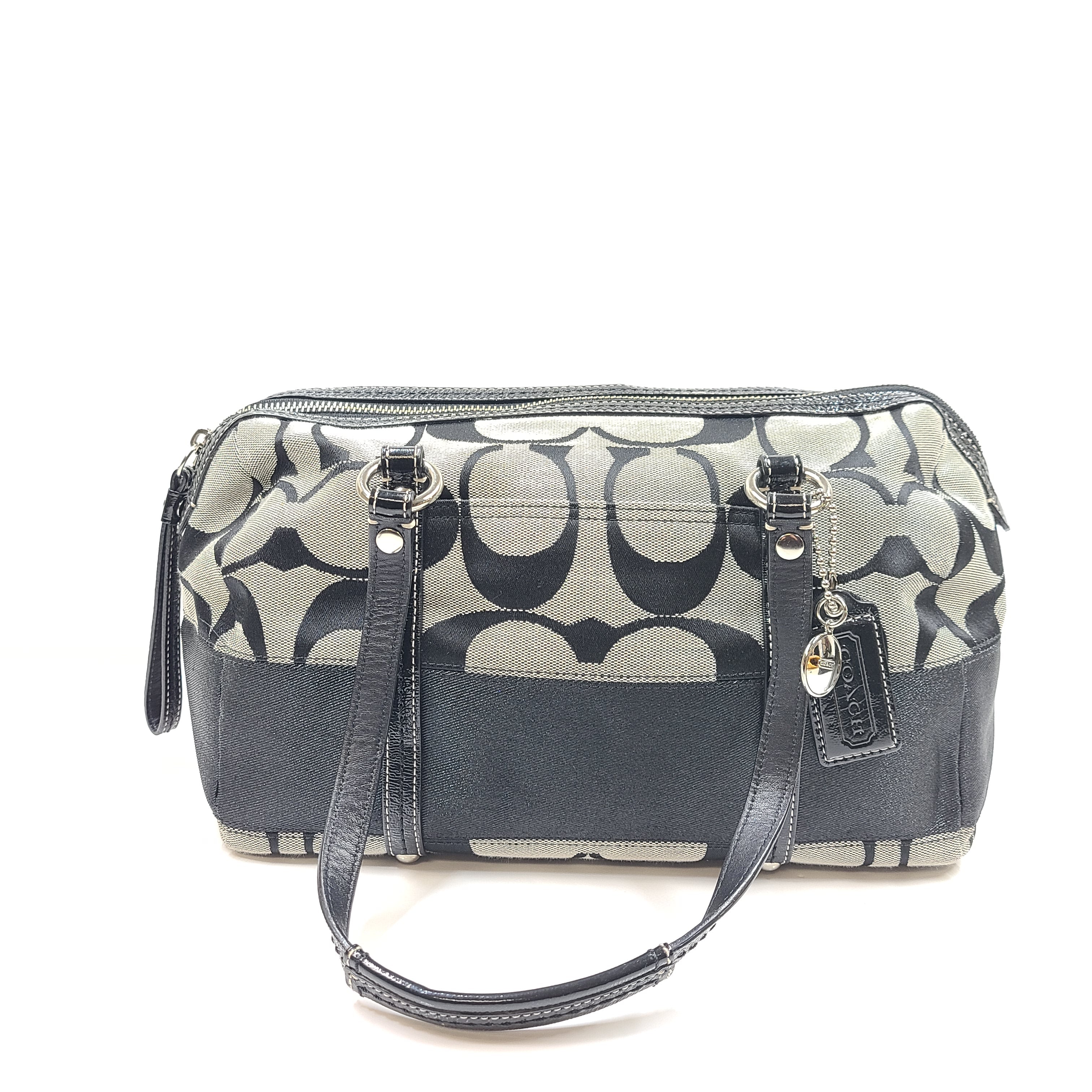 Gray and black Coach satchel with double handles, zip closure, and an interior patch stating handcrafted Coach leather.